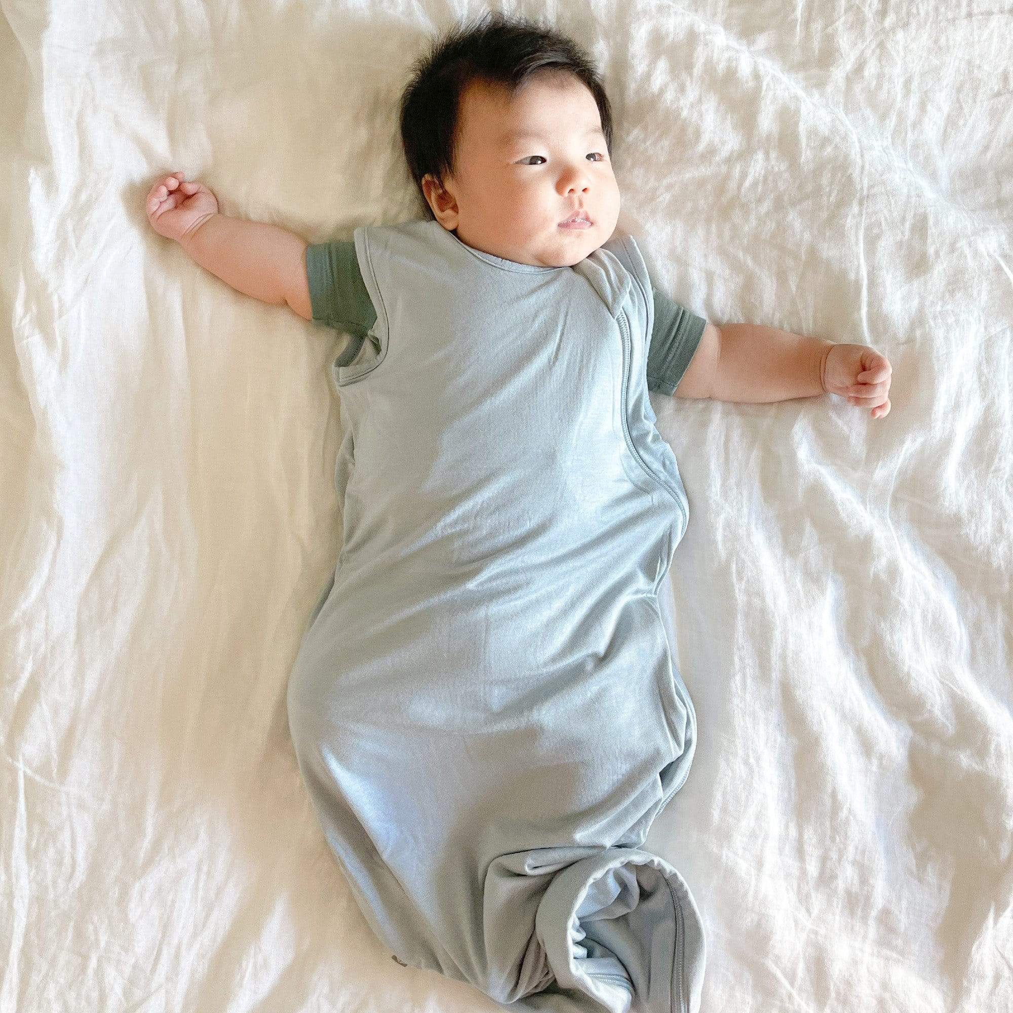 Baby wearing Kyte Baby bamboo Sleep Bag 0.5 in Fog