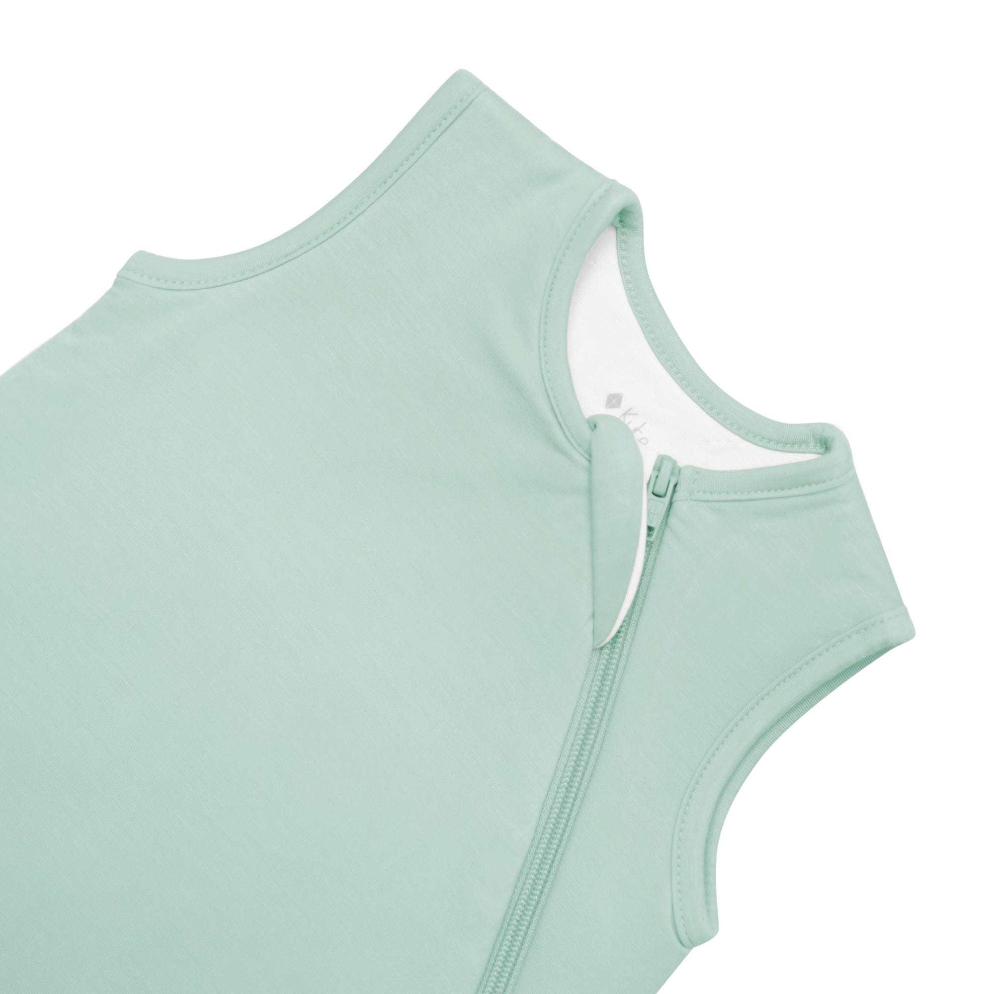 Close up of zipper garage on Kyte Baby Sleep Bag in Sage 2.5