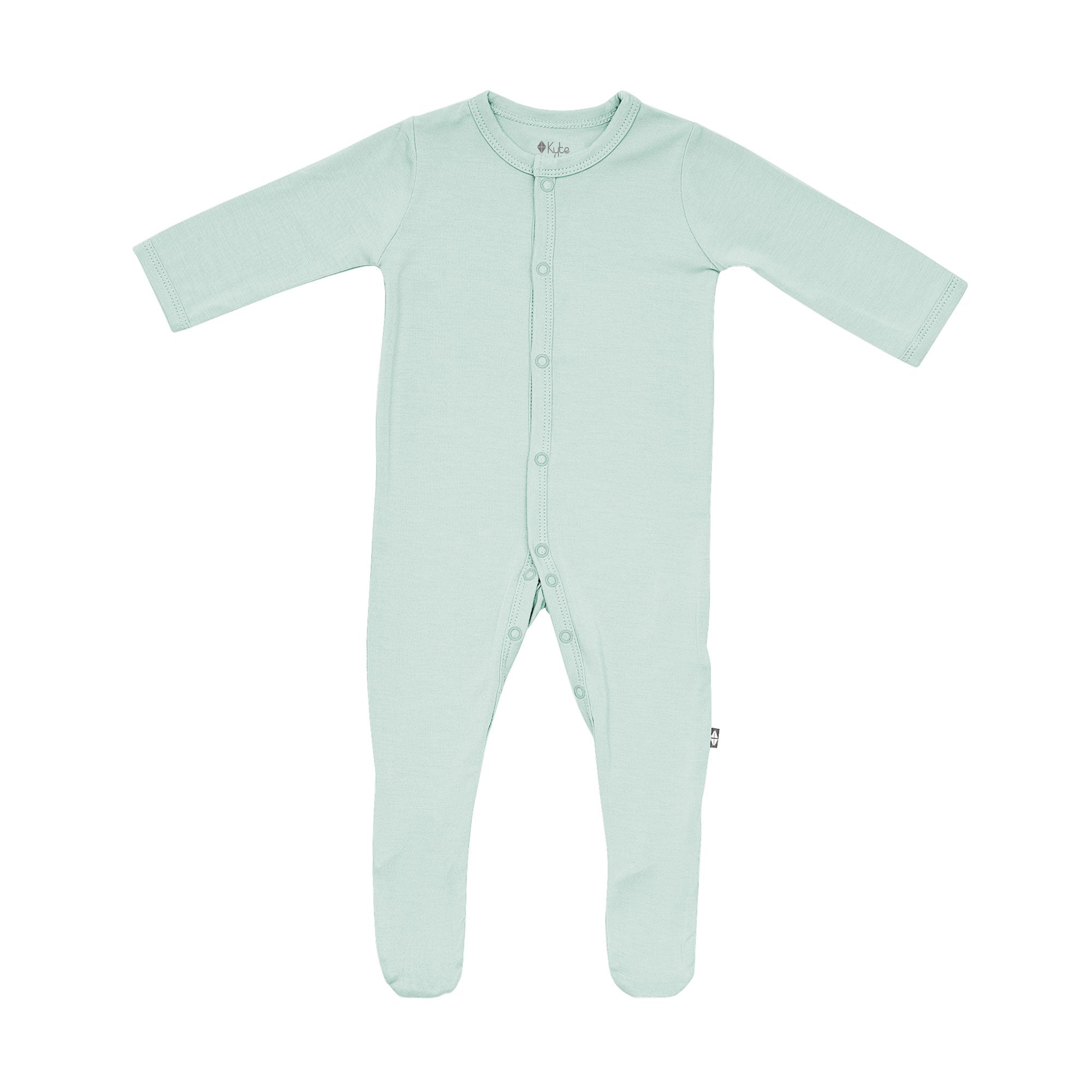 Flat lay of Kyte Baby footie in Sage
