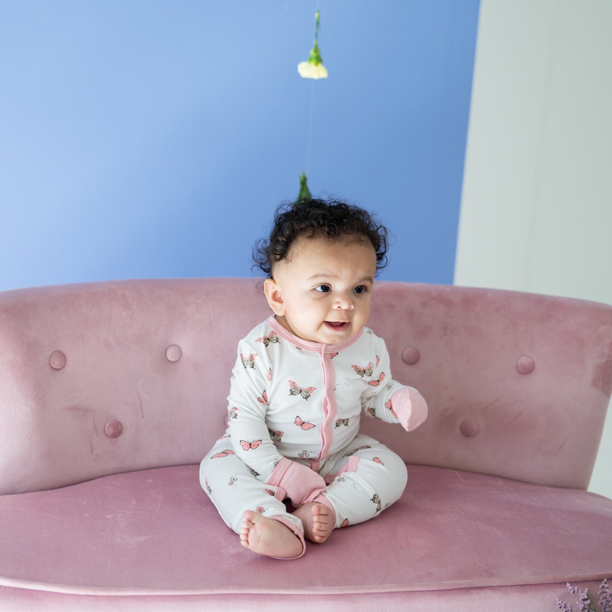 Infant wearing Kyte Baby Romper in Butterfly