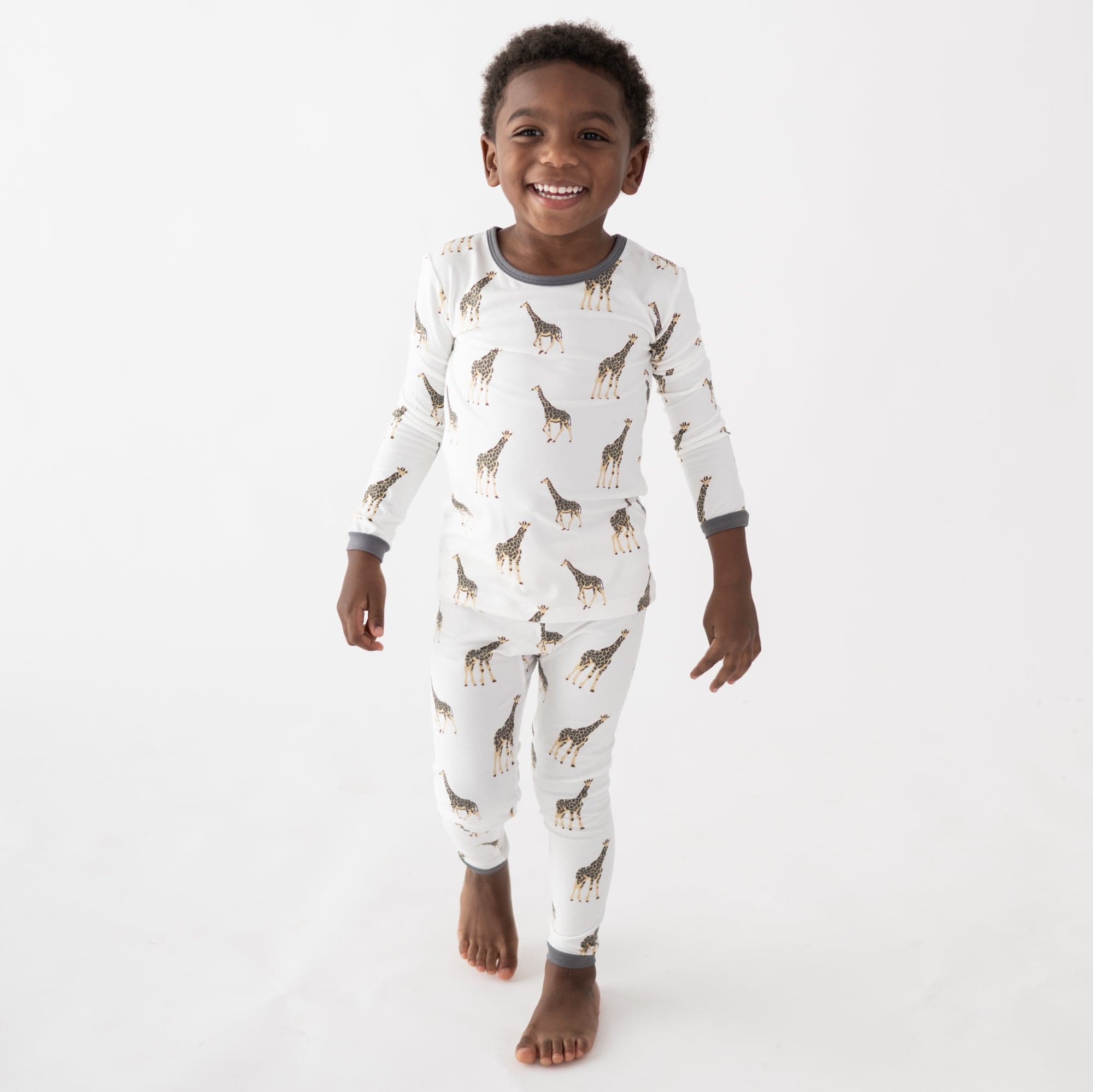 Child wearing Long Sleeve Pajamas in Giraffe