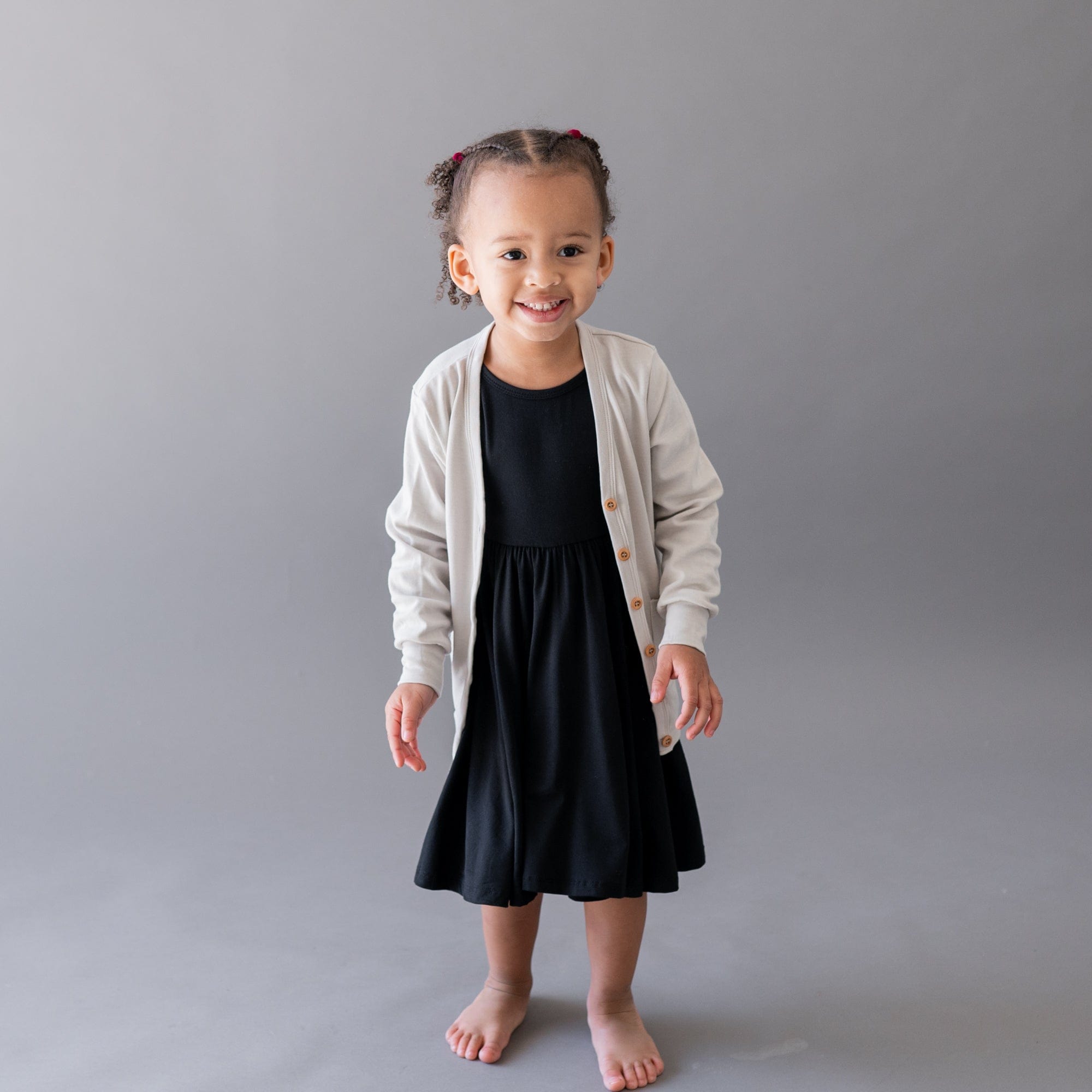 Toddler wearing Kyte Baby bamboo Long Sleeve Twirl Dress in Midnight