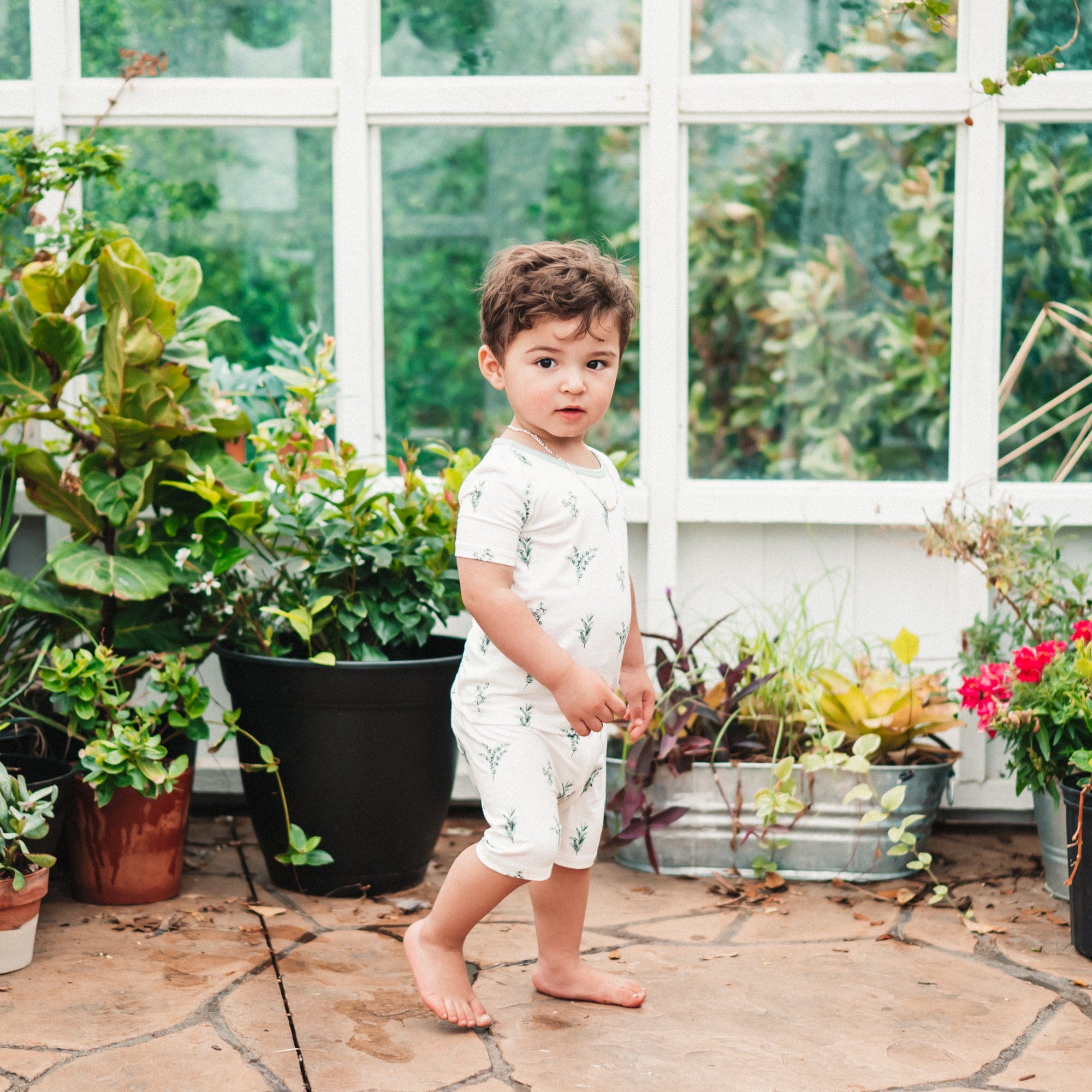 Toddler wearing Kyte Baby bamboo Short Sleeve Pajamas in Eucalyptus