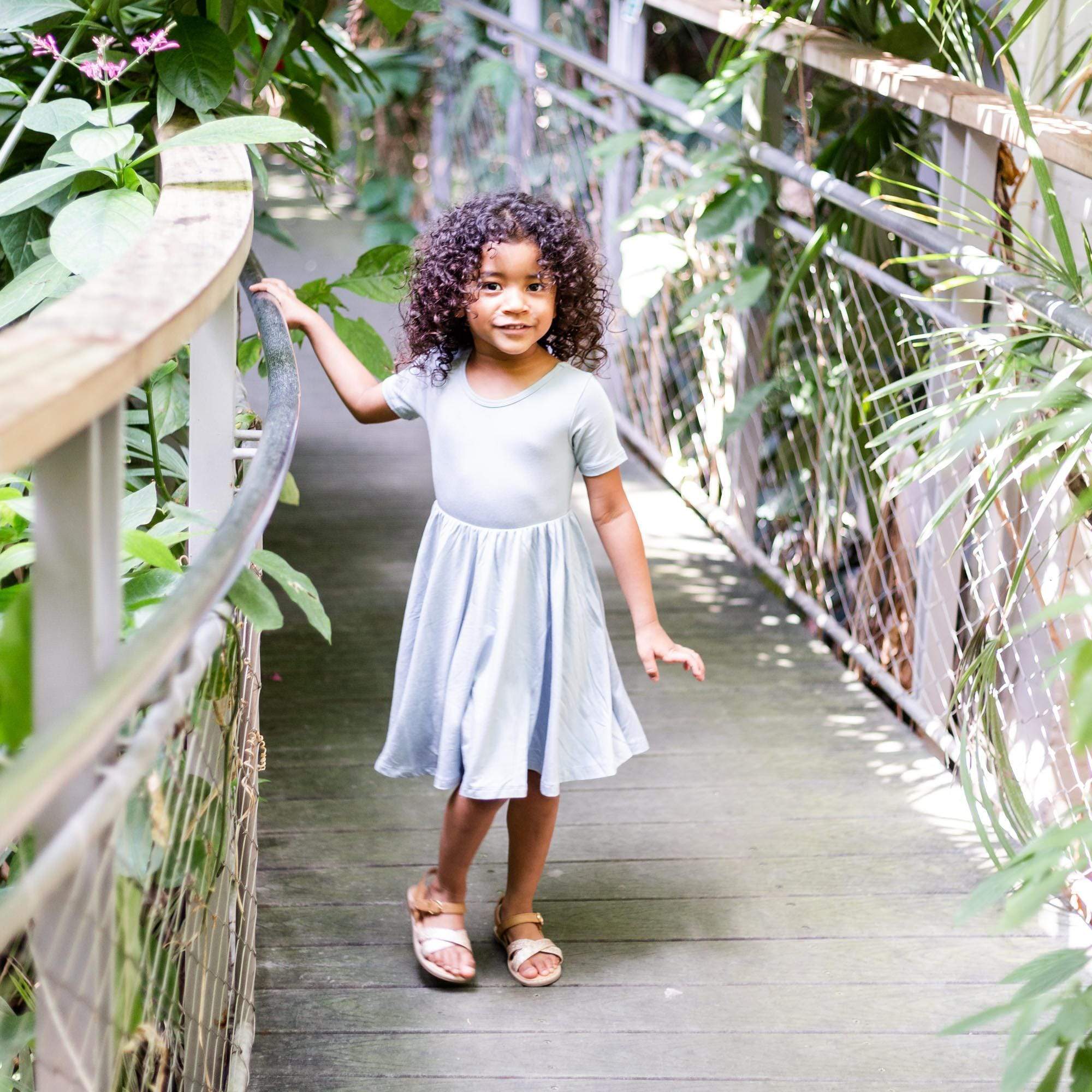 Toddler wearing Kyte Baby Twirl Dress in Fog