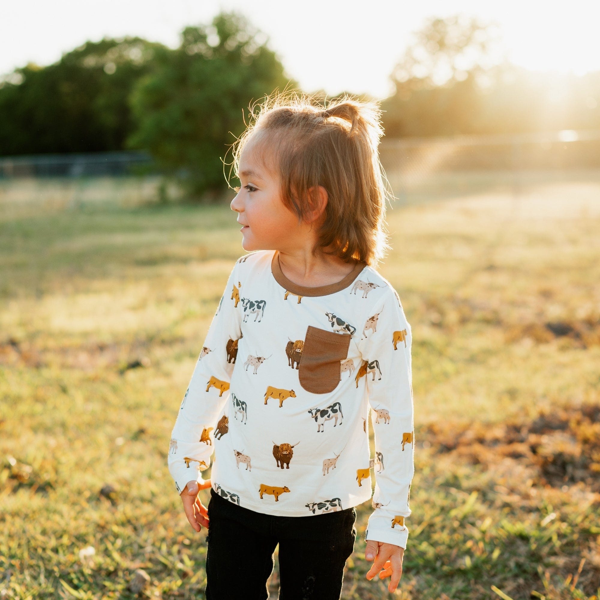 Child wearing Kyte Baby bamboo Long Sleeve Crew Neck Tee in Moo