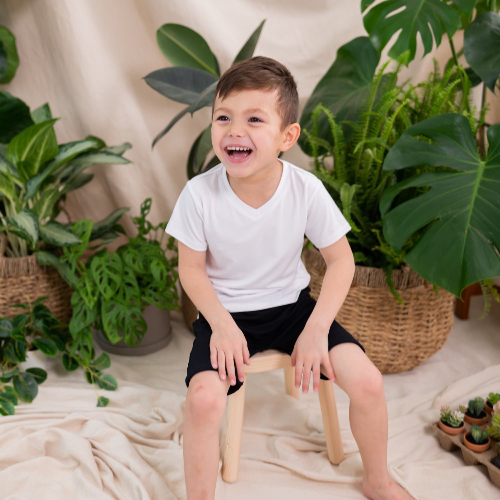 Boy wearing Kyte Baby Toddler V-Neck Tee in Snow