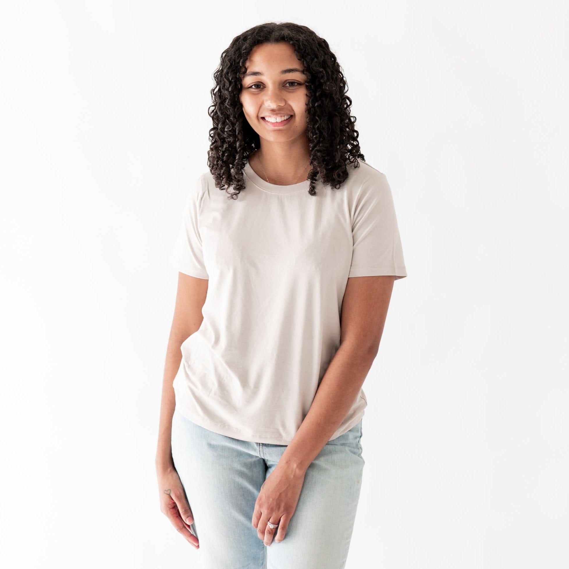 Woman wearing Kyte Baby Women's bamboo Crew Neck Tee in Oat