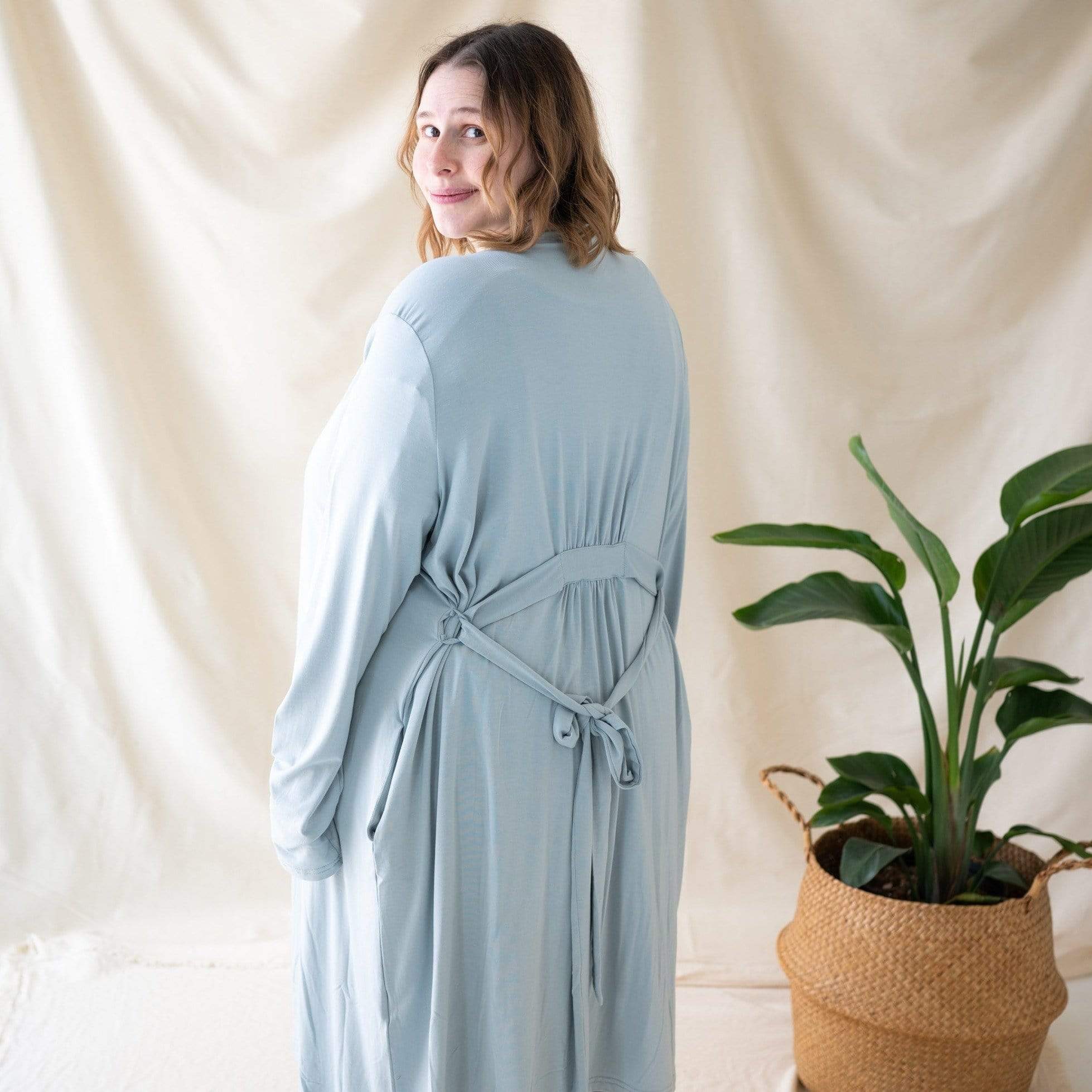Woman wearing Kyte Baby Women’s bamboo Lounge Robe in Fog gray