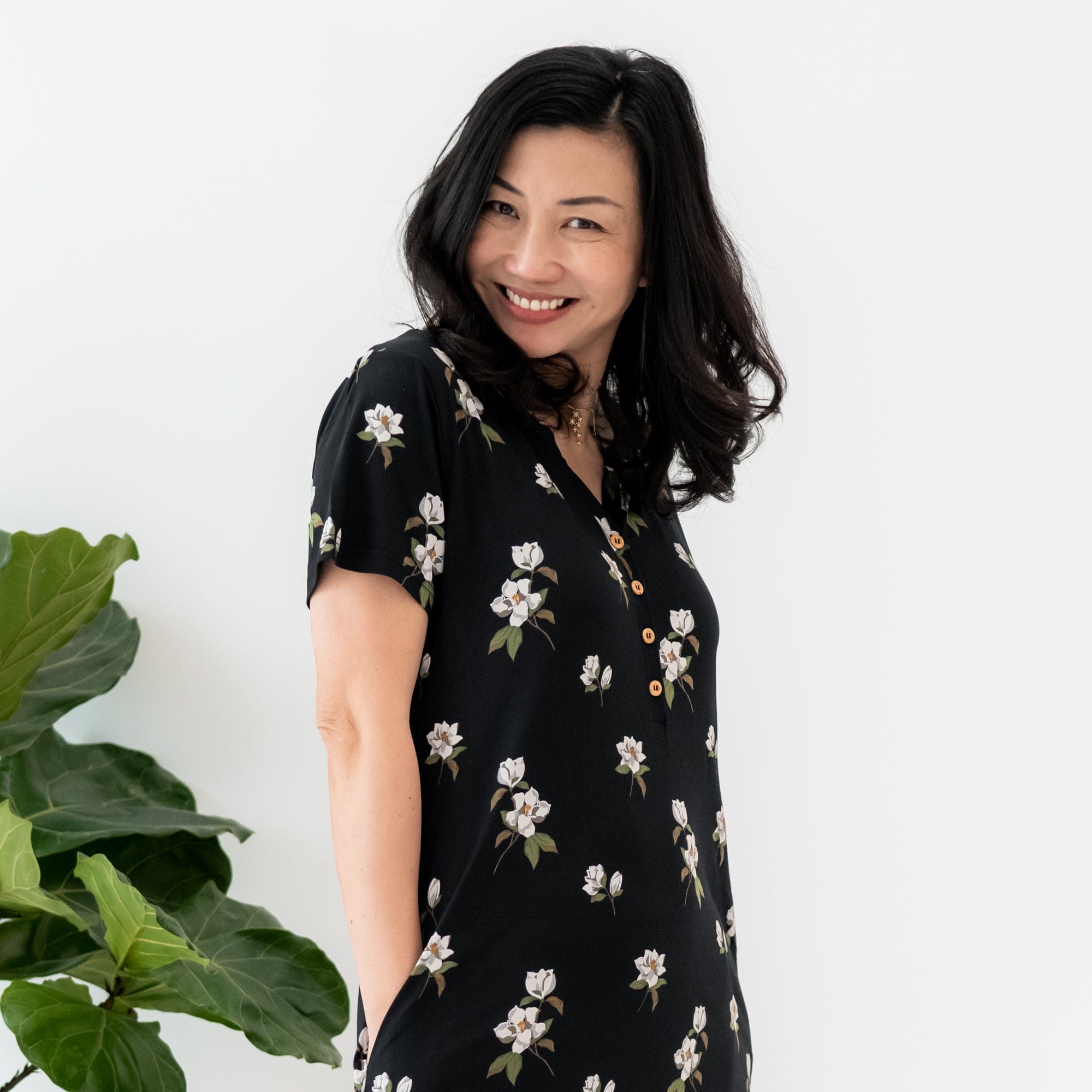 Woman wearing Midi Lounge Dress with buttons in Big Midnight Magnolia