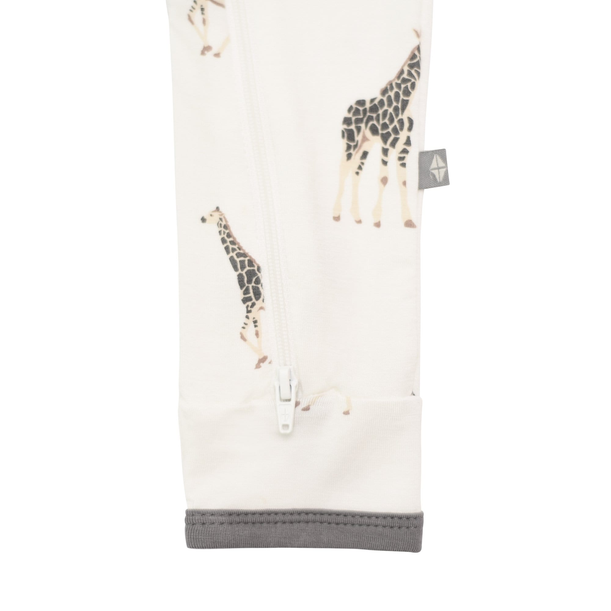 Open feet on Kyte Baby Zippered Romper in Giraffe