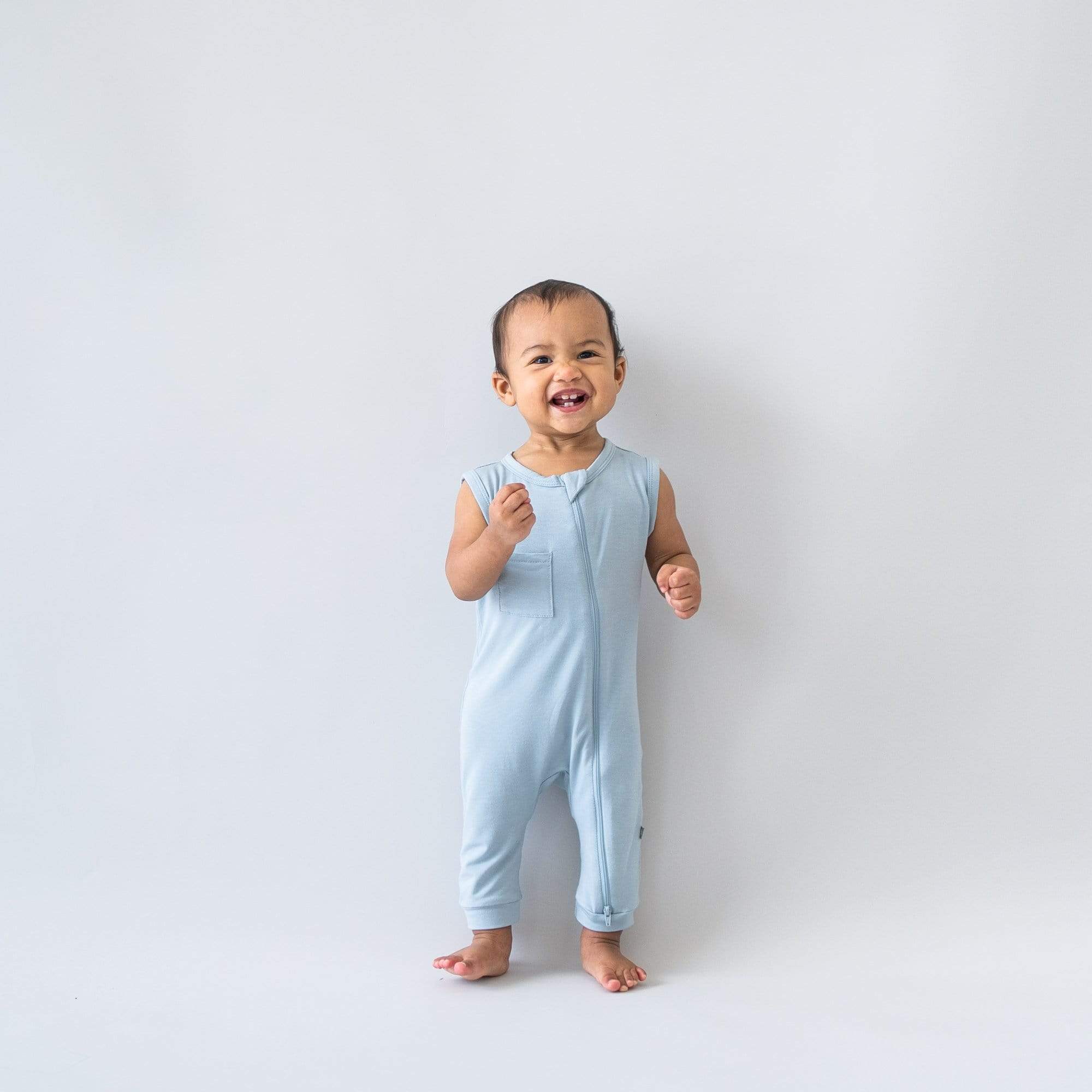 Toddler wearing Kyte Baby Sleeveless Zippered Romper in Fog
