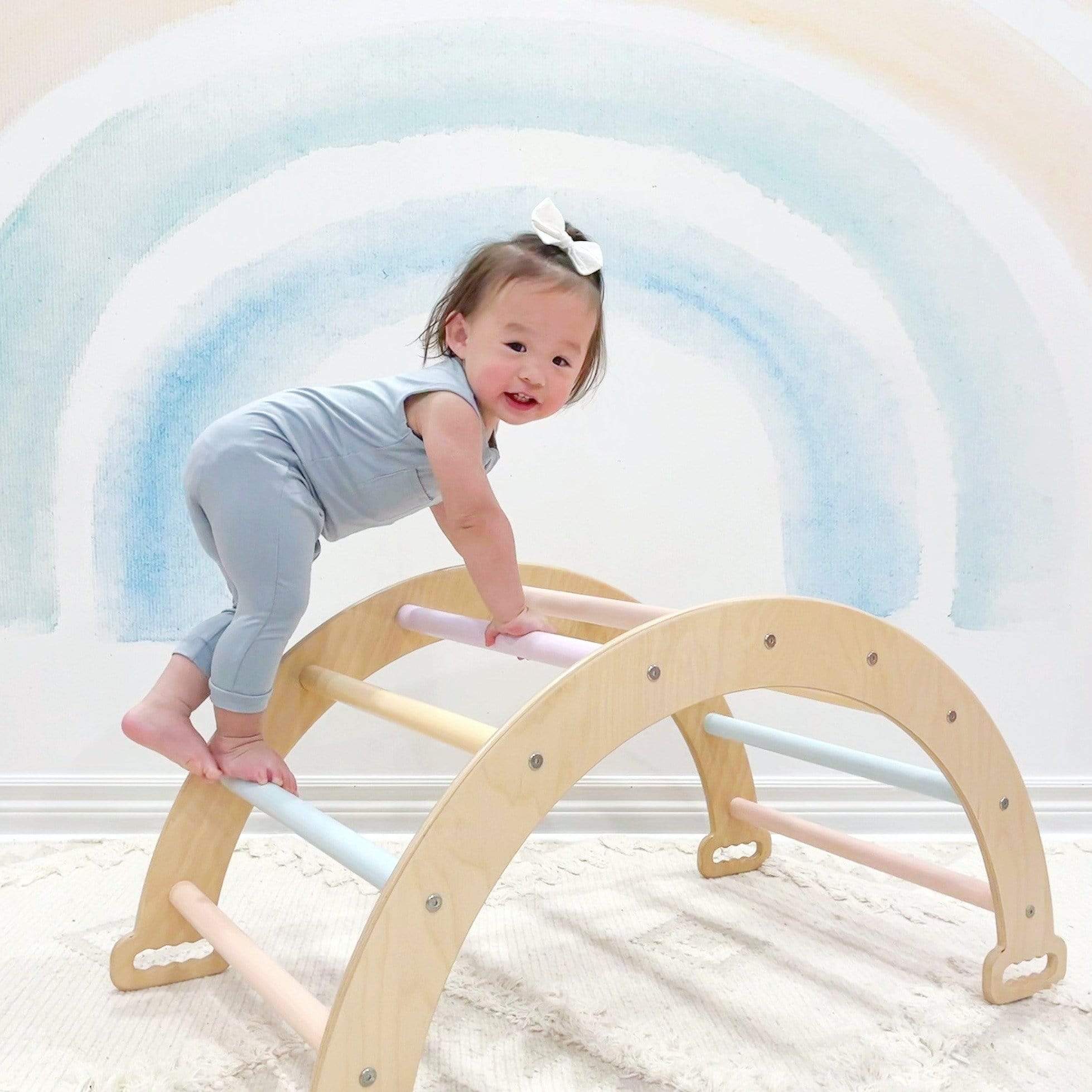 Toddler playing in Kyte Baby bamboo Sleeveless Zippered Romper in Fog