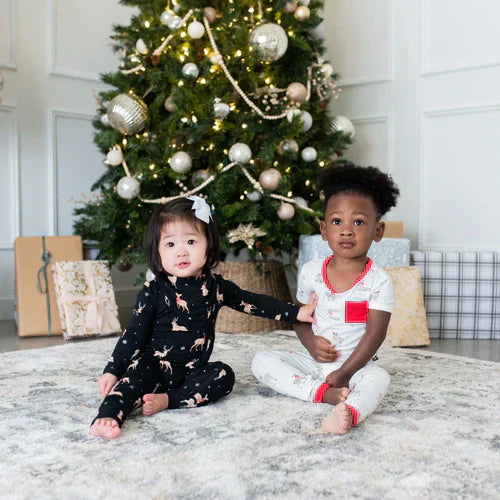 Toddlers ready for Christmas in their Kyte Baby kids pajamas