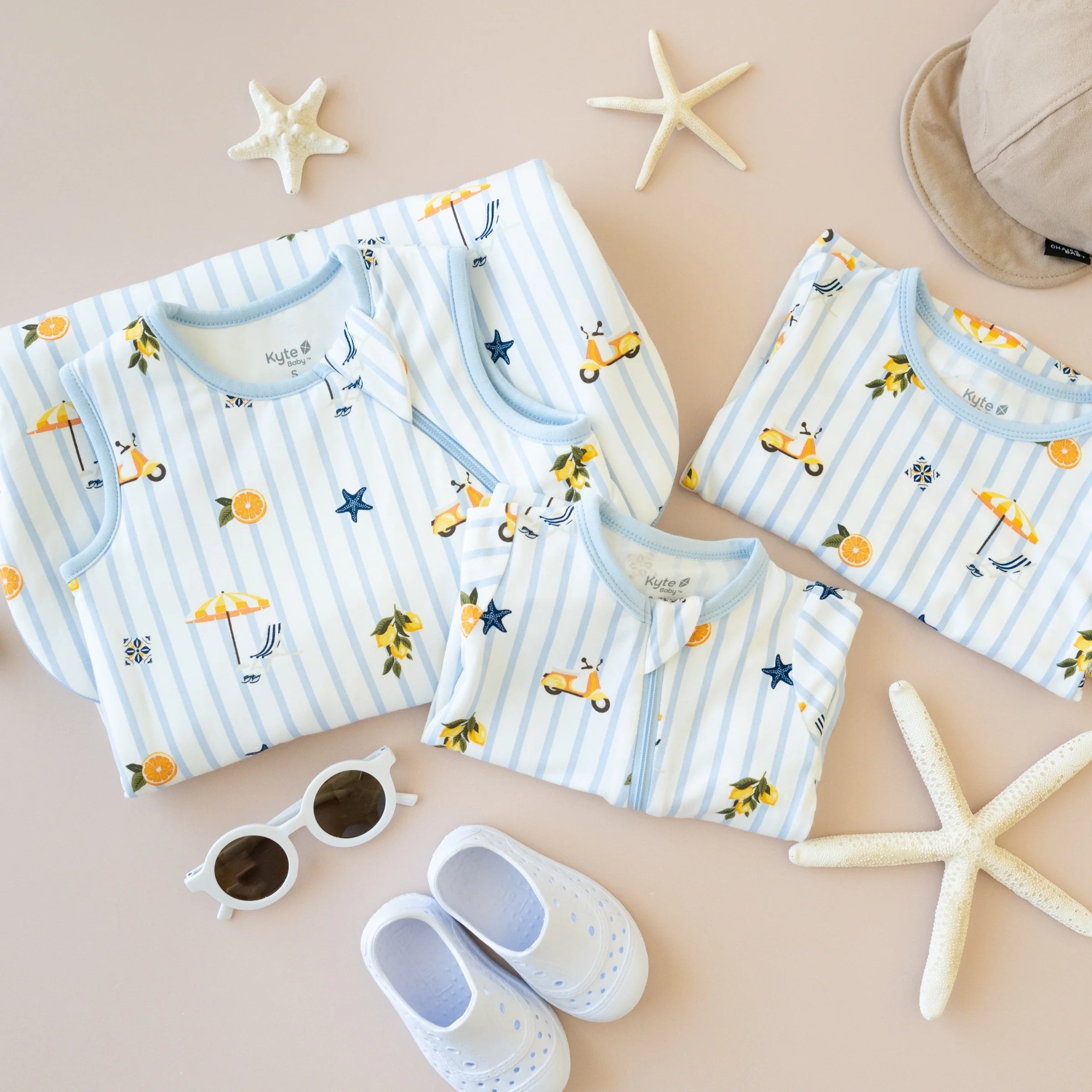 Family summer vacation packing essentials laid out flat lay
