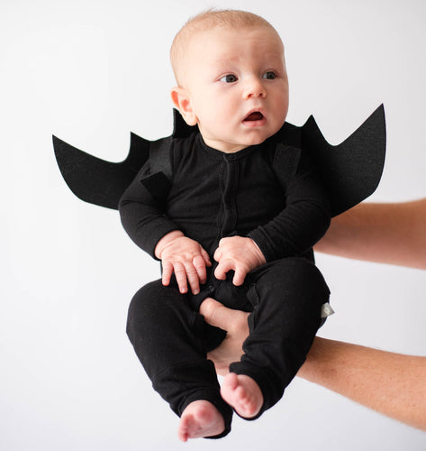 Baby wearing bat DIY newborn costume using pajamas