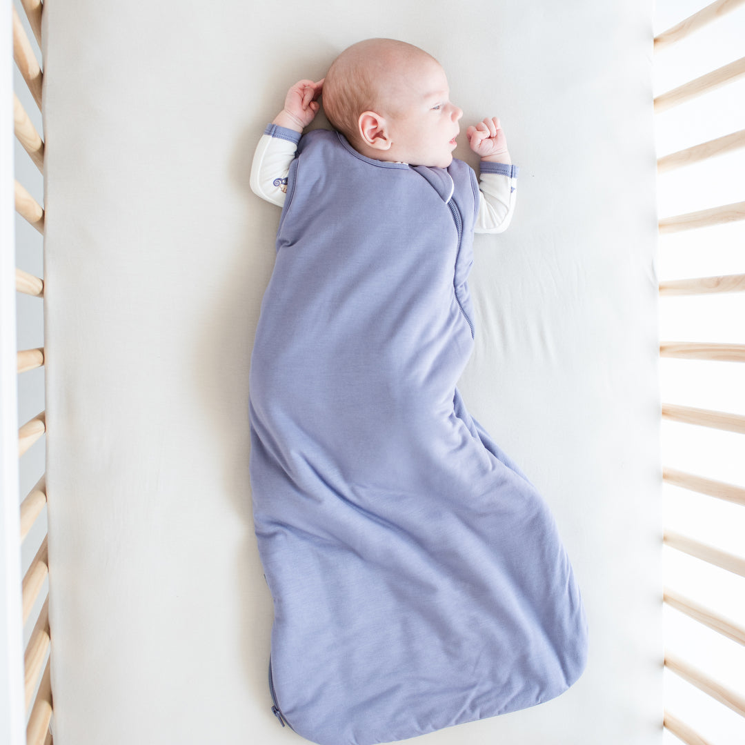 sleeping baby wearing a kyte baby sleep bag