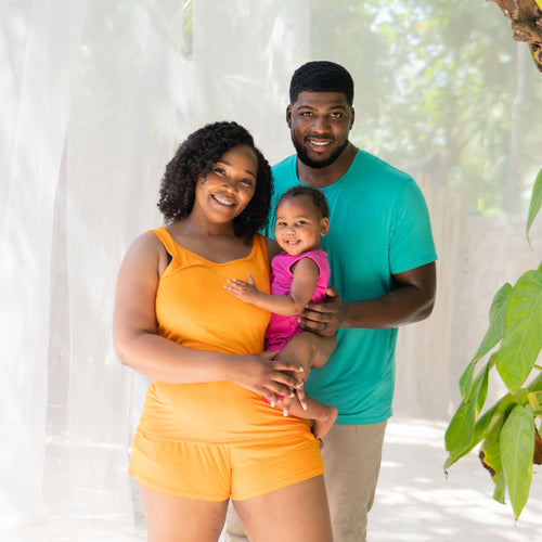 Family wearing coordinating bamboo clothing in bright, summer colors