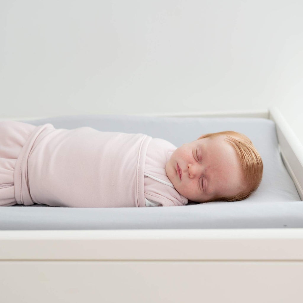 baby sleeping in a kyte baby sleep bag swaddler