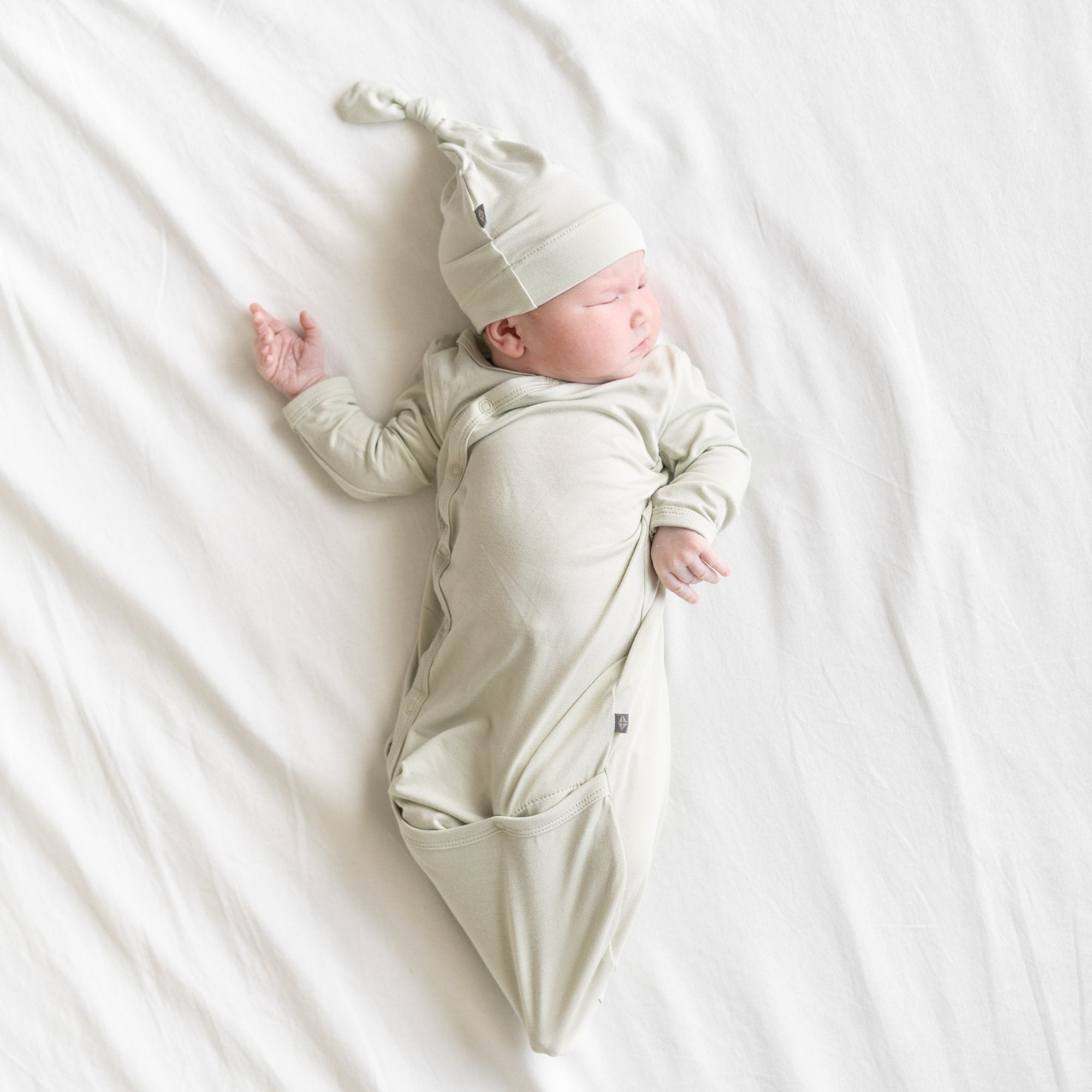 Baby Wearing Bundler and Hat in Aloe