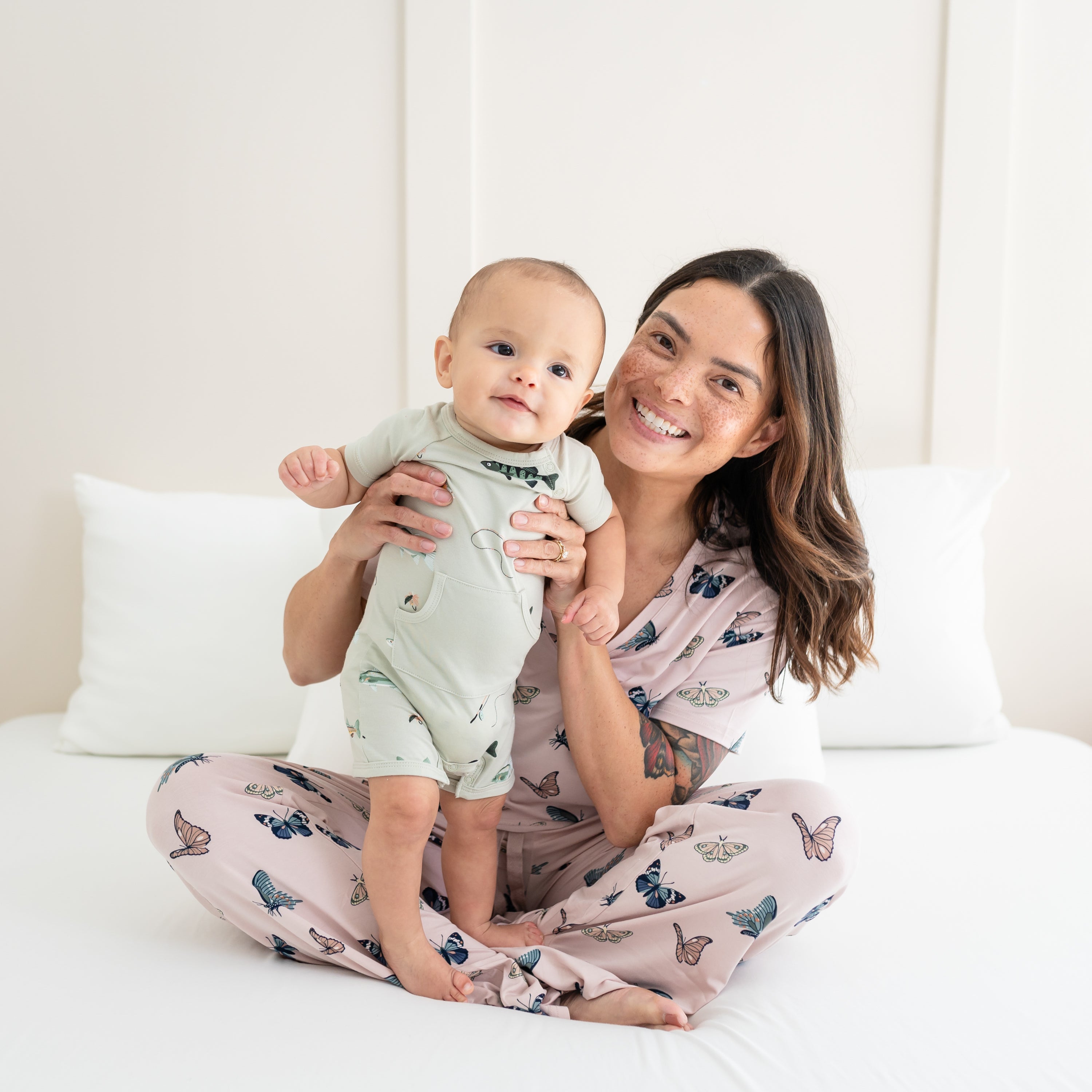 Mom and Baby wearing Kyte Baby Women's Buterfly V-neck and Lounge Pants and Fishing Shortall