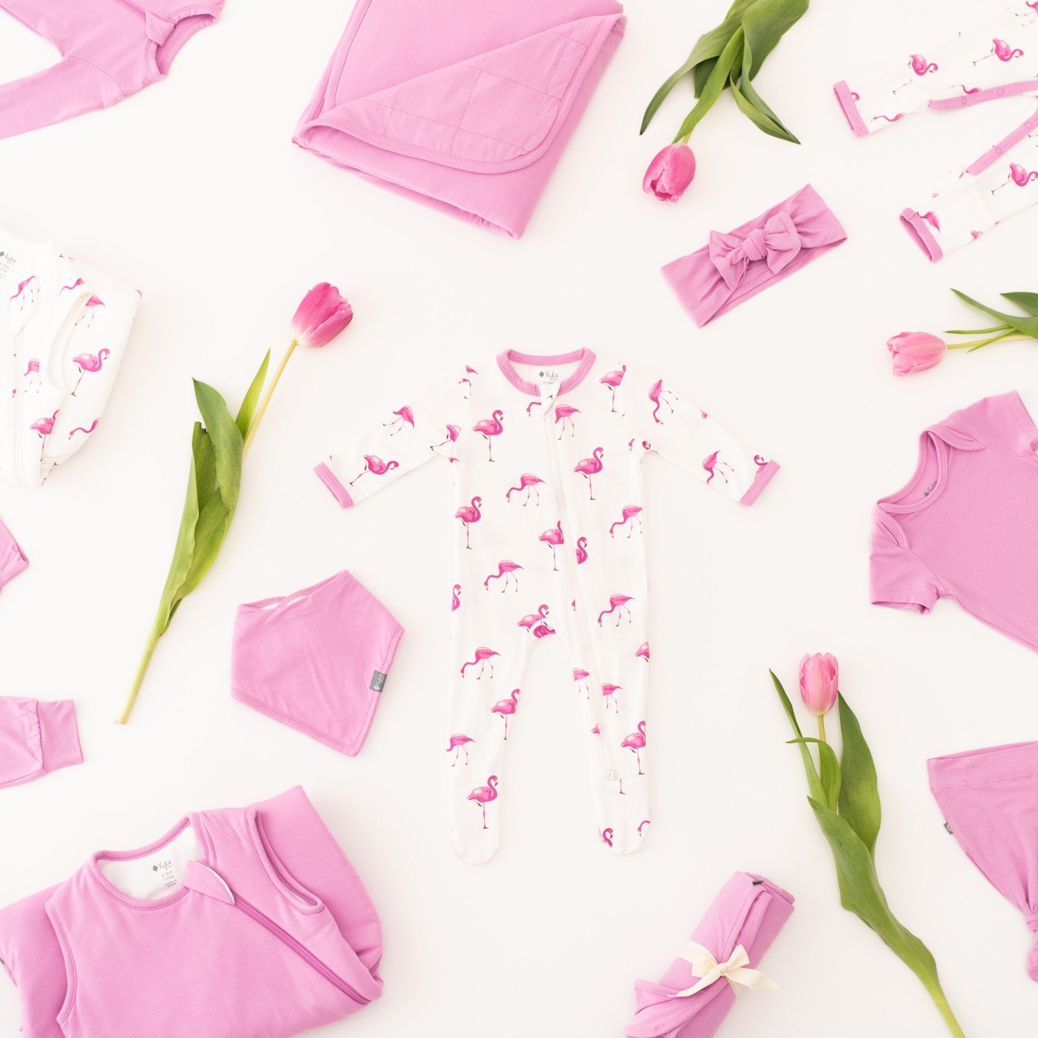 Bubblegum and Flamingo Apparel Pieces Laying in Random Formation