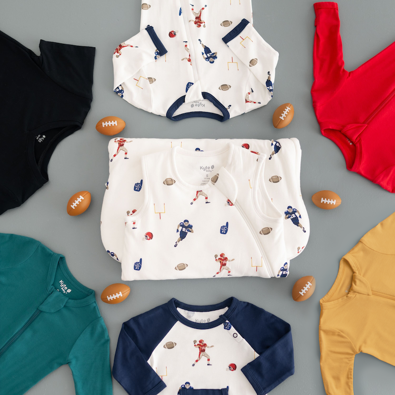 Flat lay of football, cardinal, marigold, emerald and midnight