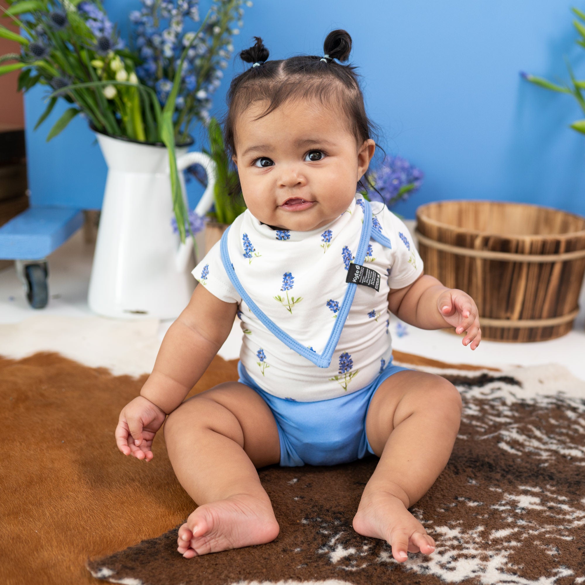 toddler wearing bamboo onesie with bummies and a bib