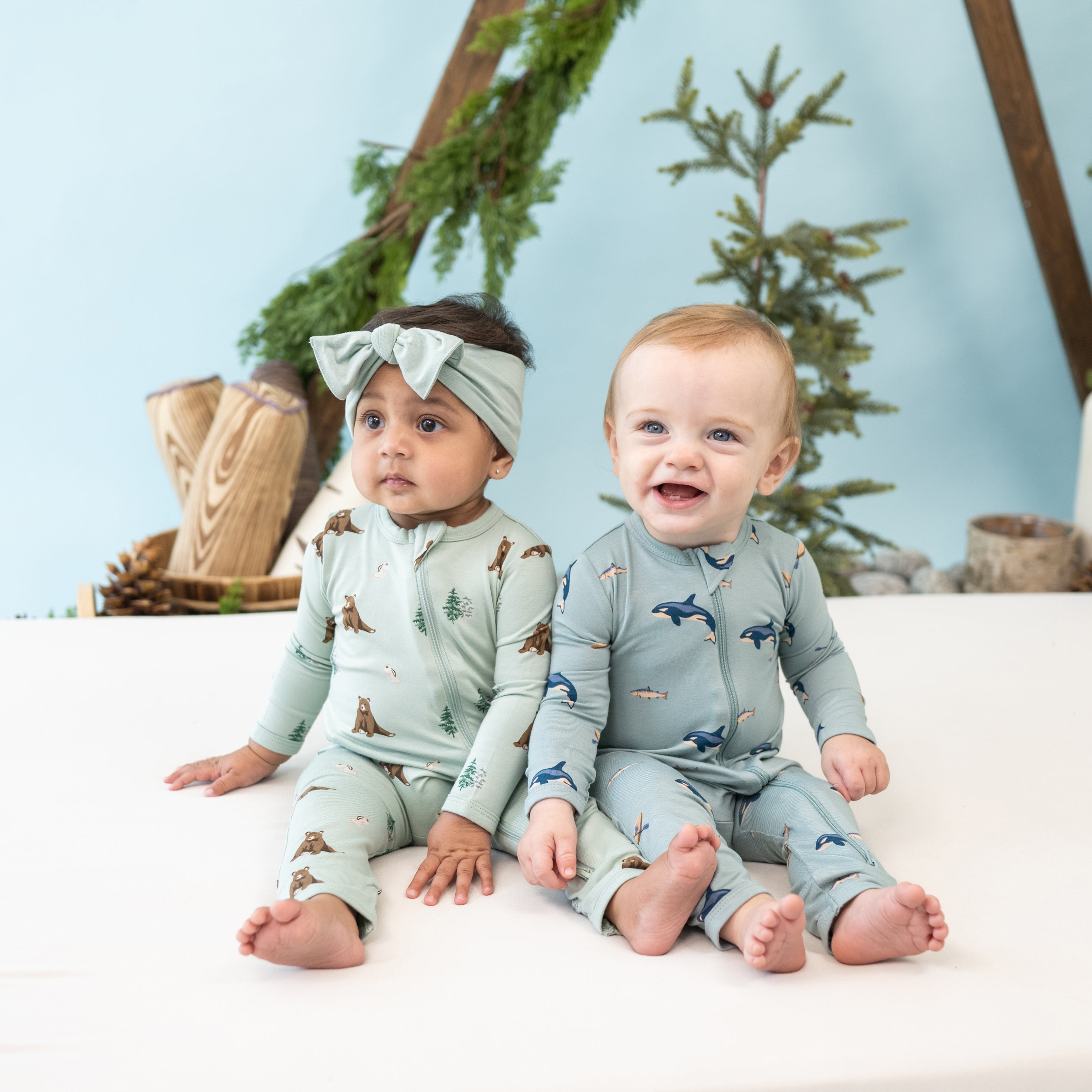 babies wearing zippered romper