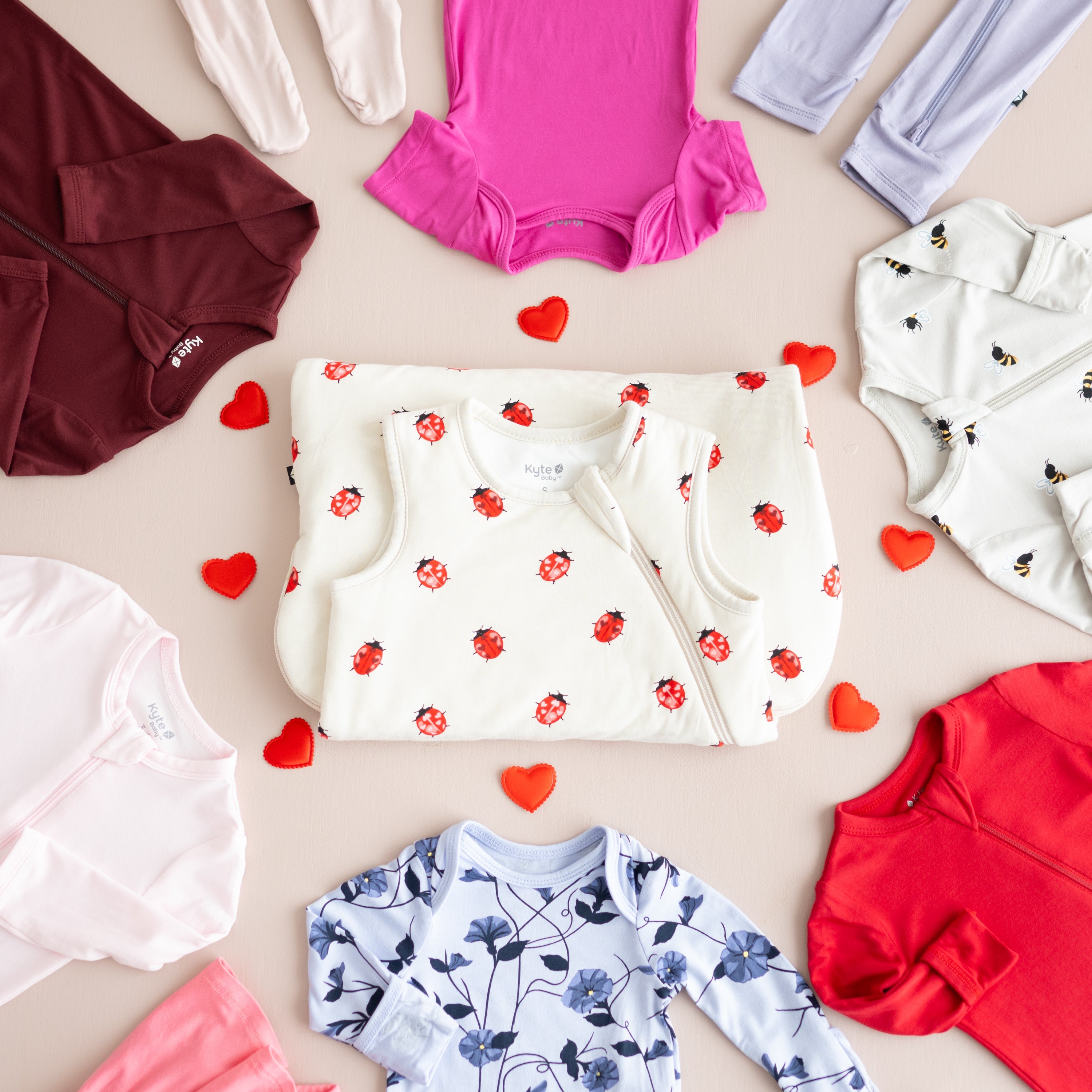 Valentine's Day flat lay including solids and prints that are red, pink, purple and white
