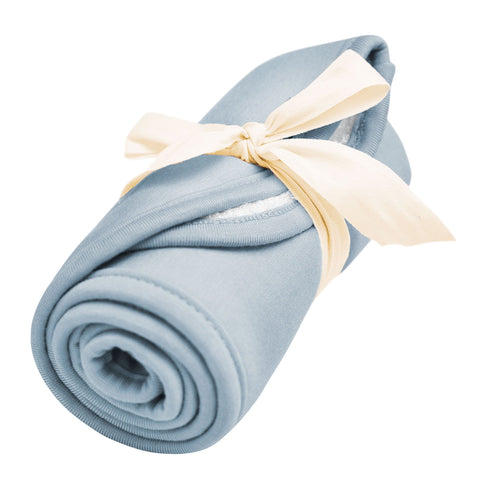 Burp cloth in the color fog rolled up and tied with a bow