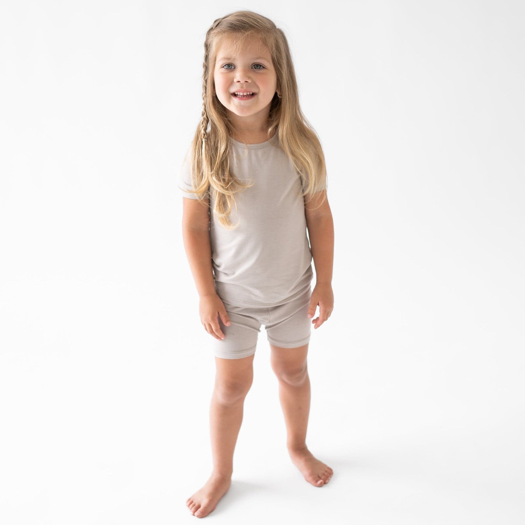 toddler modeling short sleeve toddler pajamas in khaki