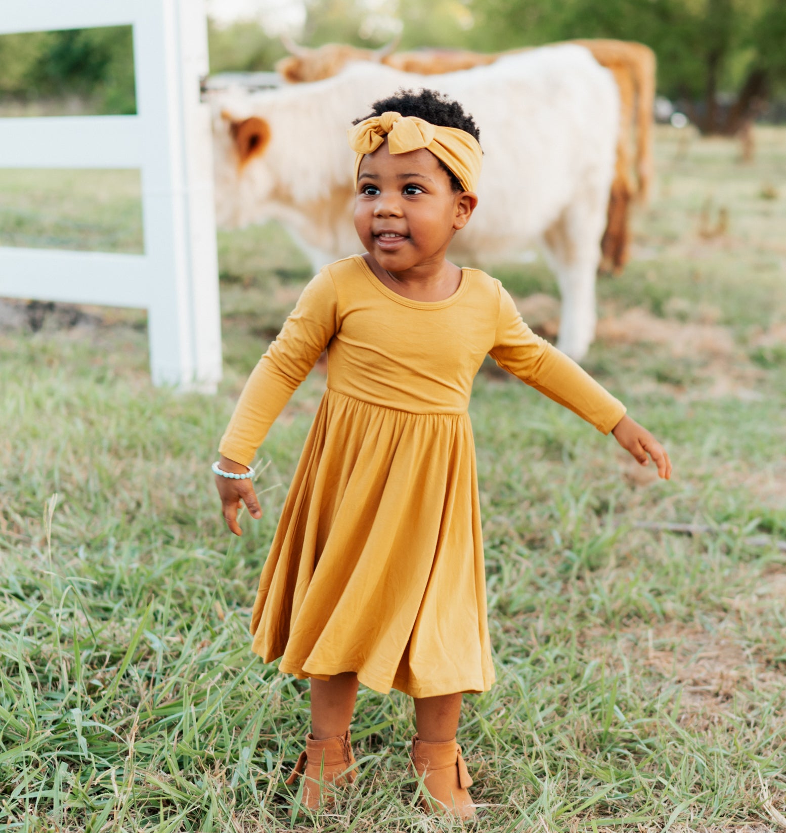 toddler modeling twirl dress marigold