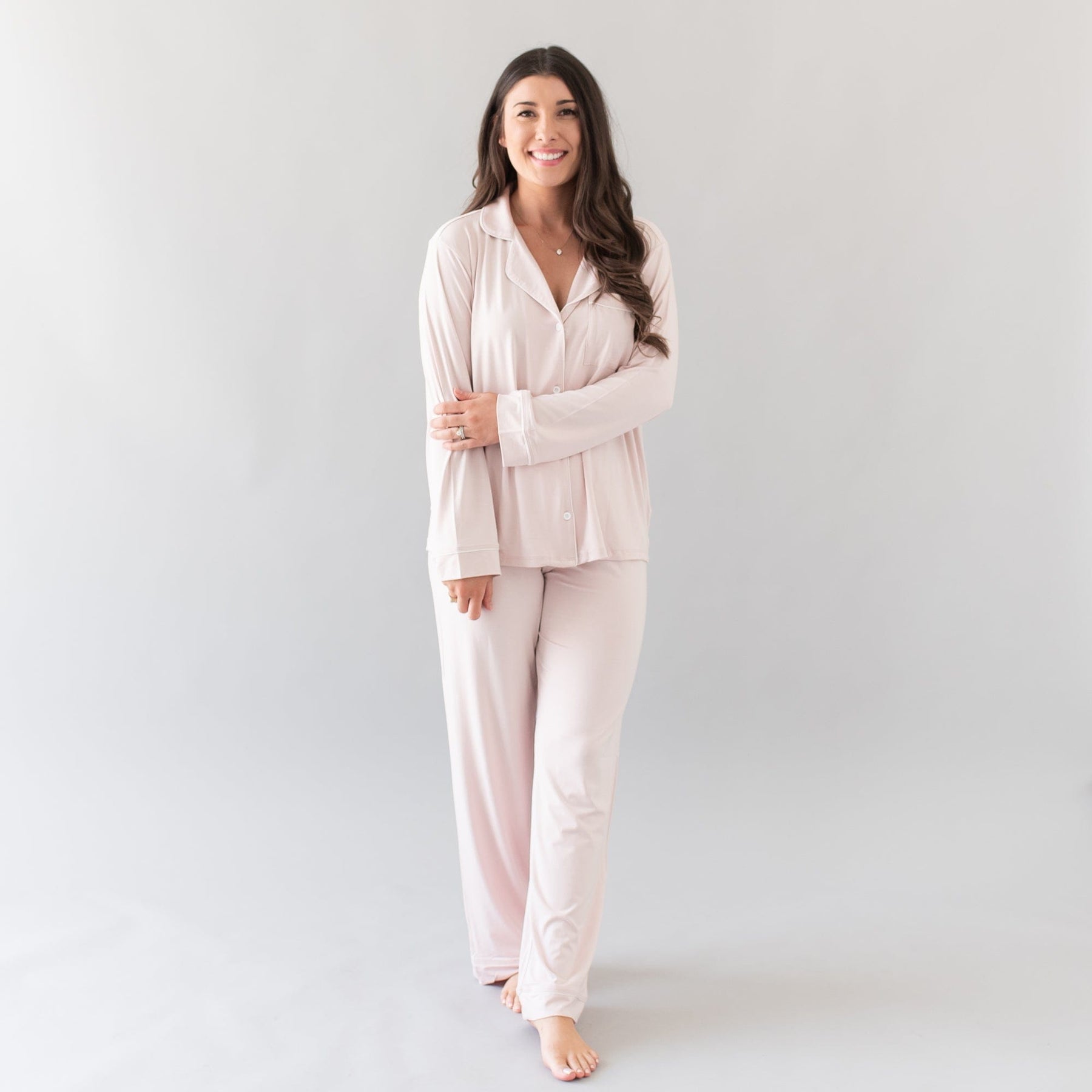 woman modeling long sleeve pajamas in blush