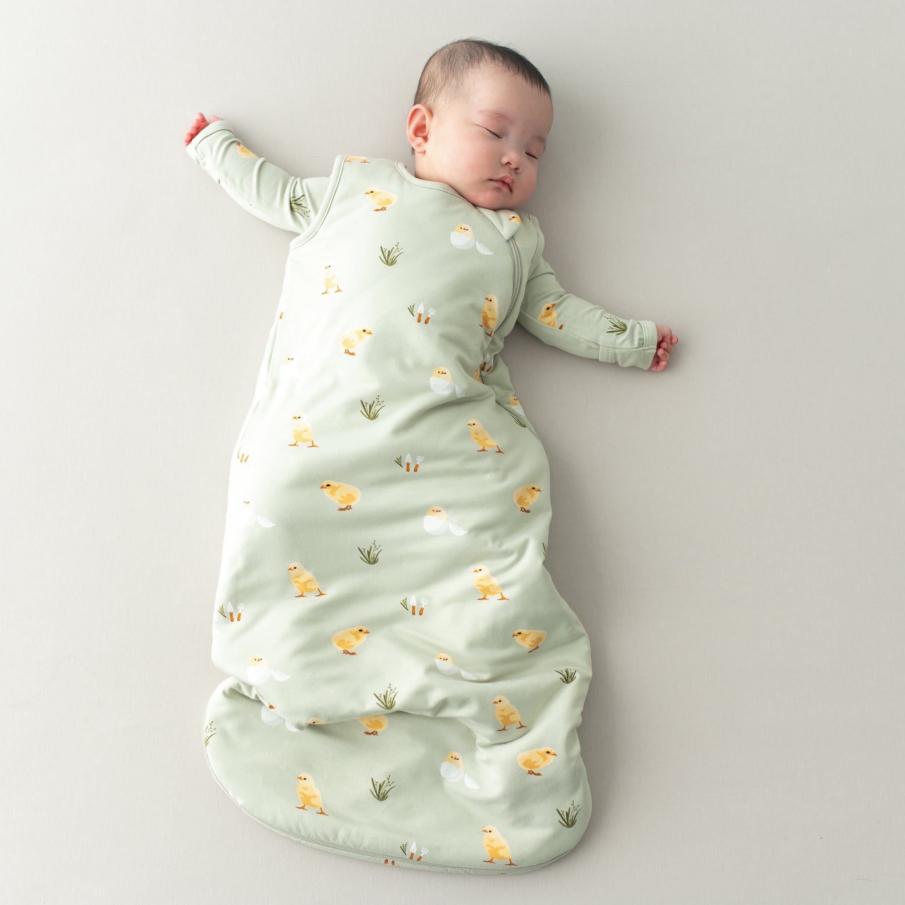 Baby sleeping in Sleep Bag in Aloe Chick 1.0