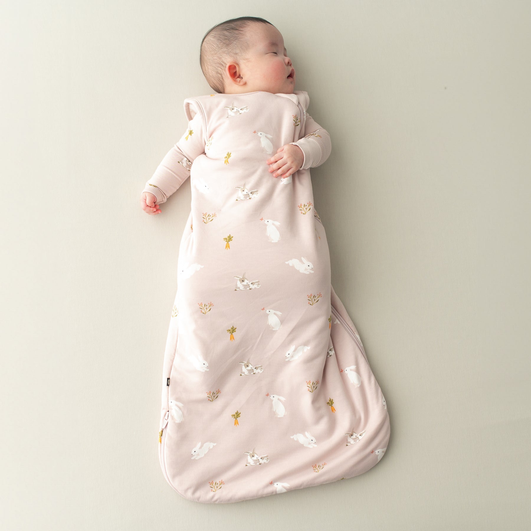 Baby sleeping in Sleep Bag in Blush Rabbit 1.0