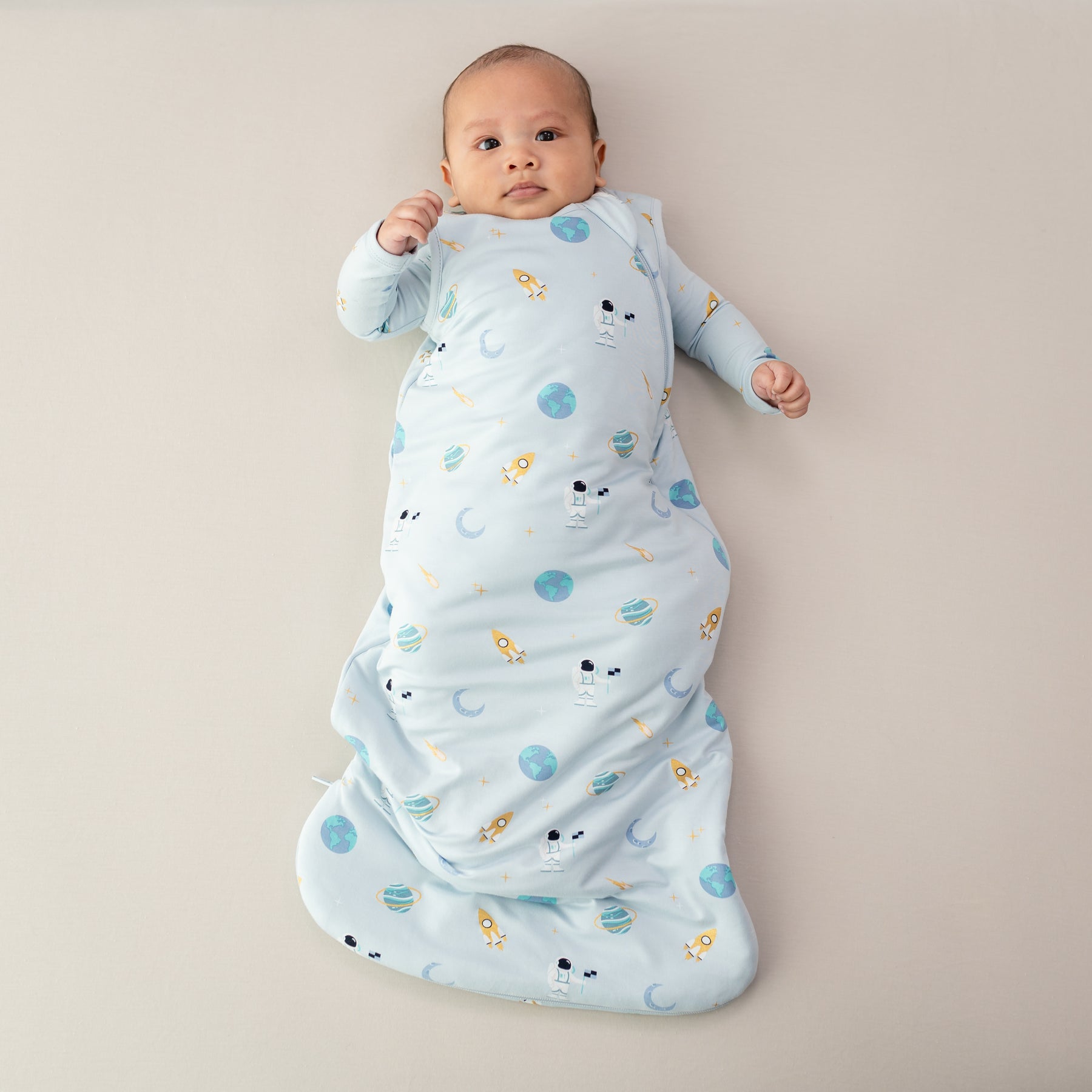 baby in sleep bag in ice space and matching footie