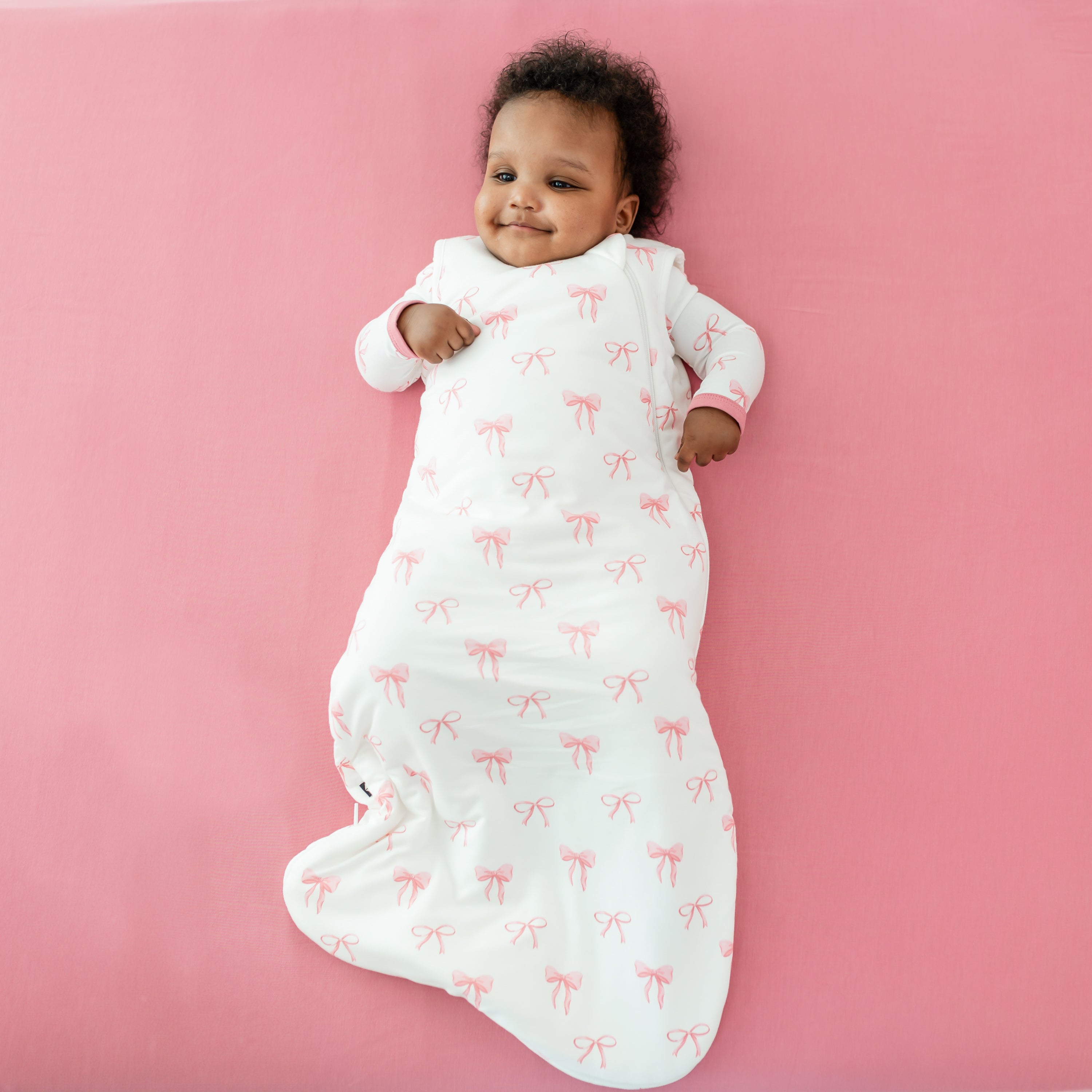 Baby wearing Sleep Bag in Bow 1.0