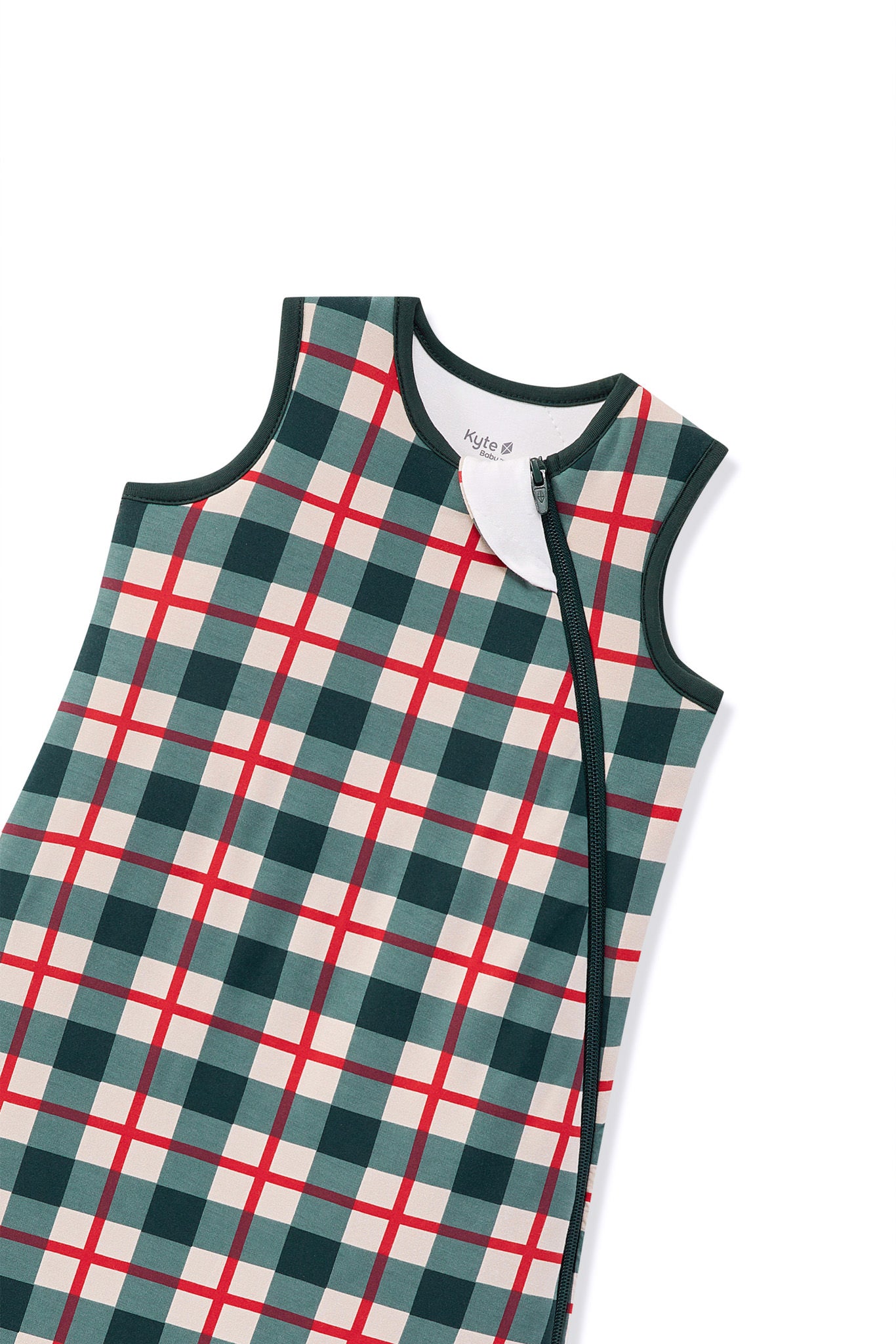 A sleeveless baby sleep sack with a green, red, and cream plaid pattern, featuring a white inner neck lining