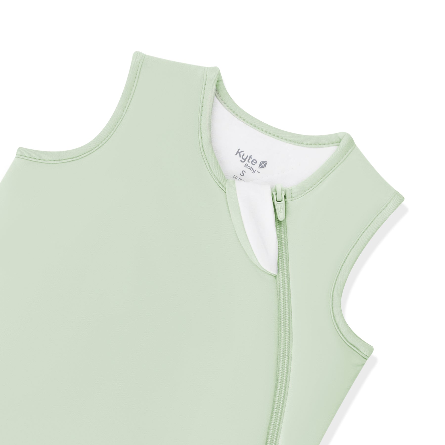 Close up of the zipper garage and top zipper on the Sleep Bag in Basil 1.0