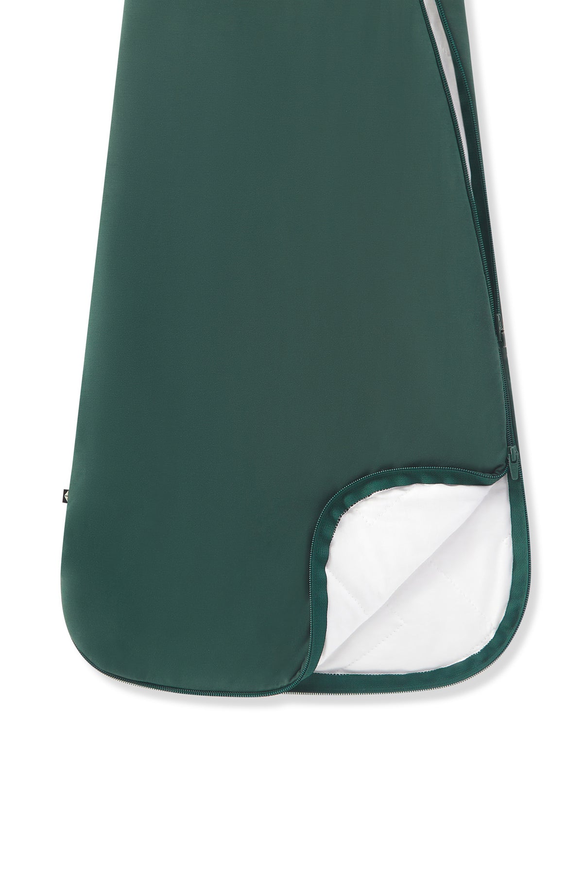 A close-up of a dark green soft sleep bag with a white inner lining visible at the corner, shown on a plain white background.