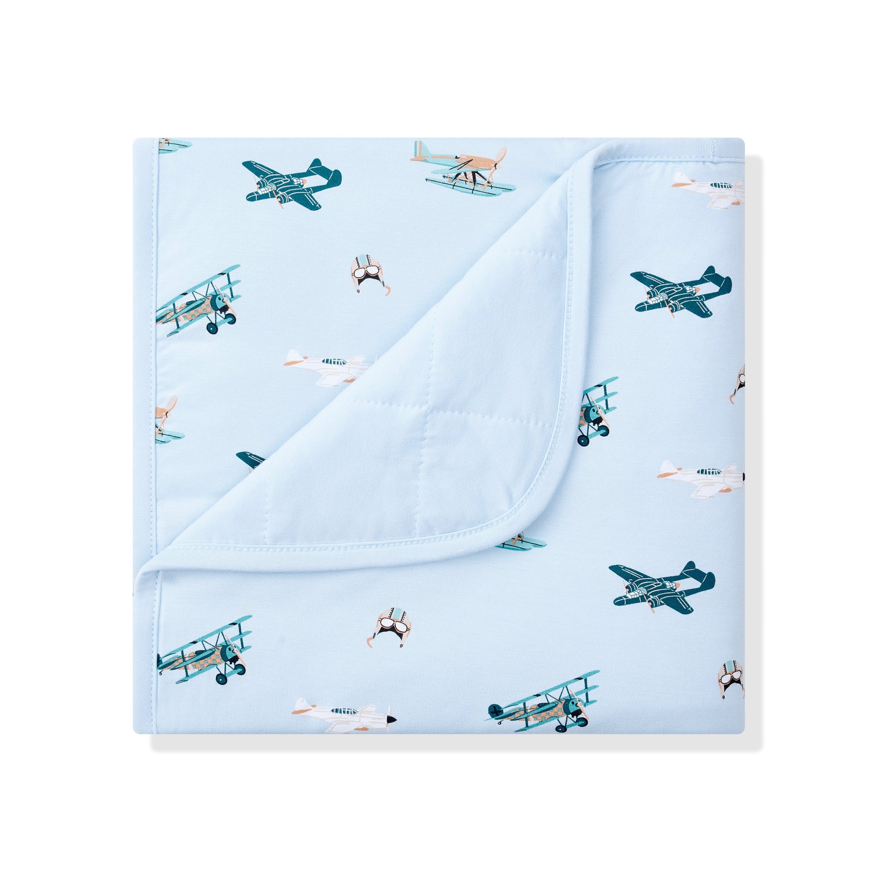 Baby Blanket in Take Off with the corner folded down showing the light blue quilted backing