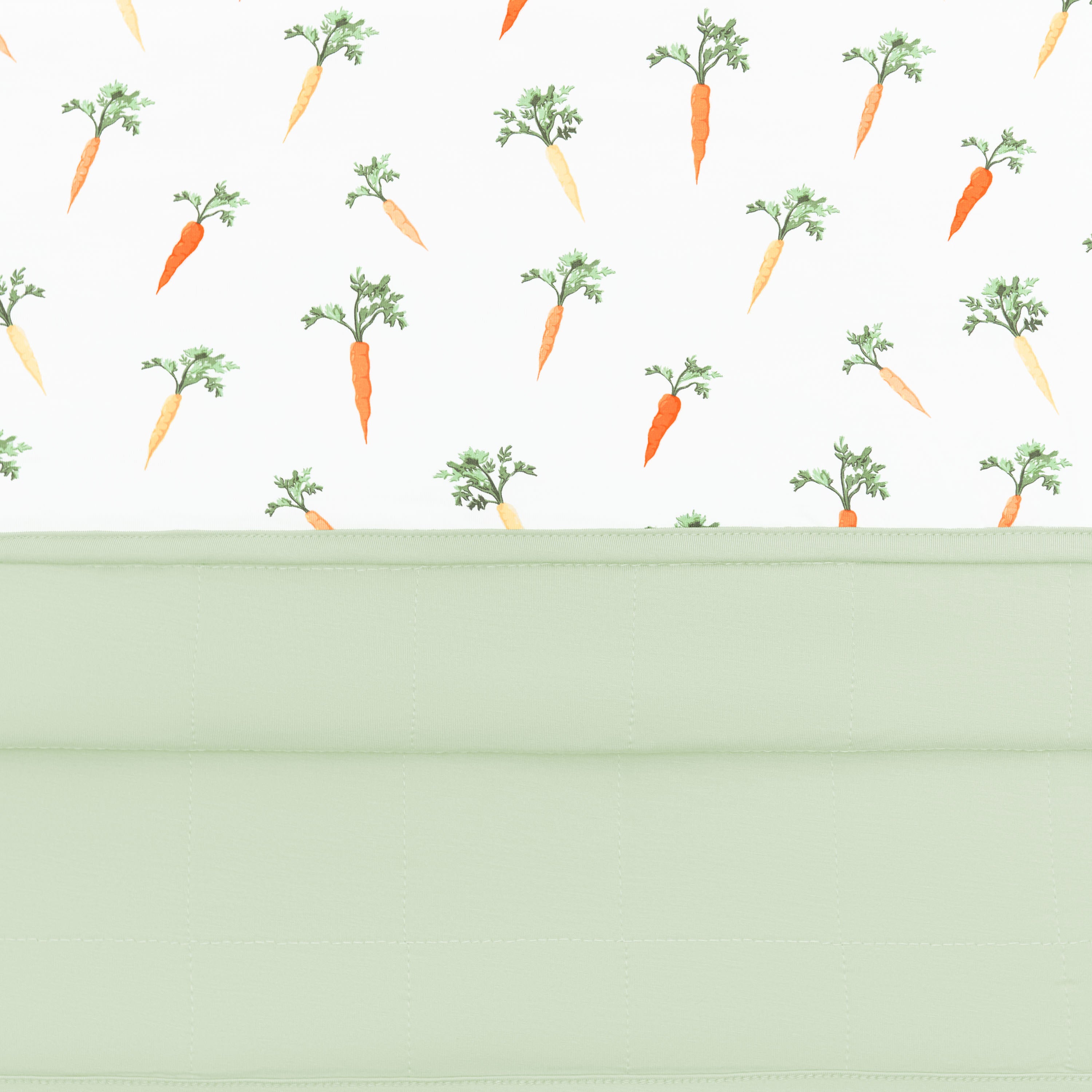 Close up of the quilted backing and smooth top of the Baby Blanket in Carrot