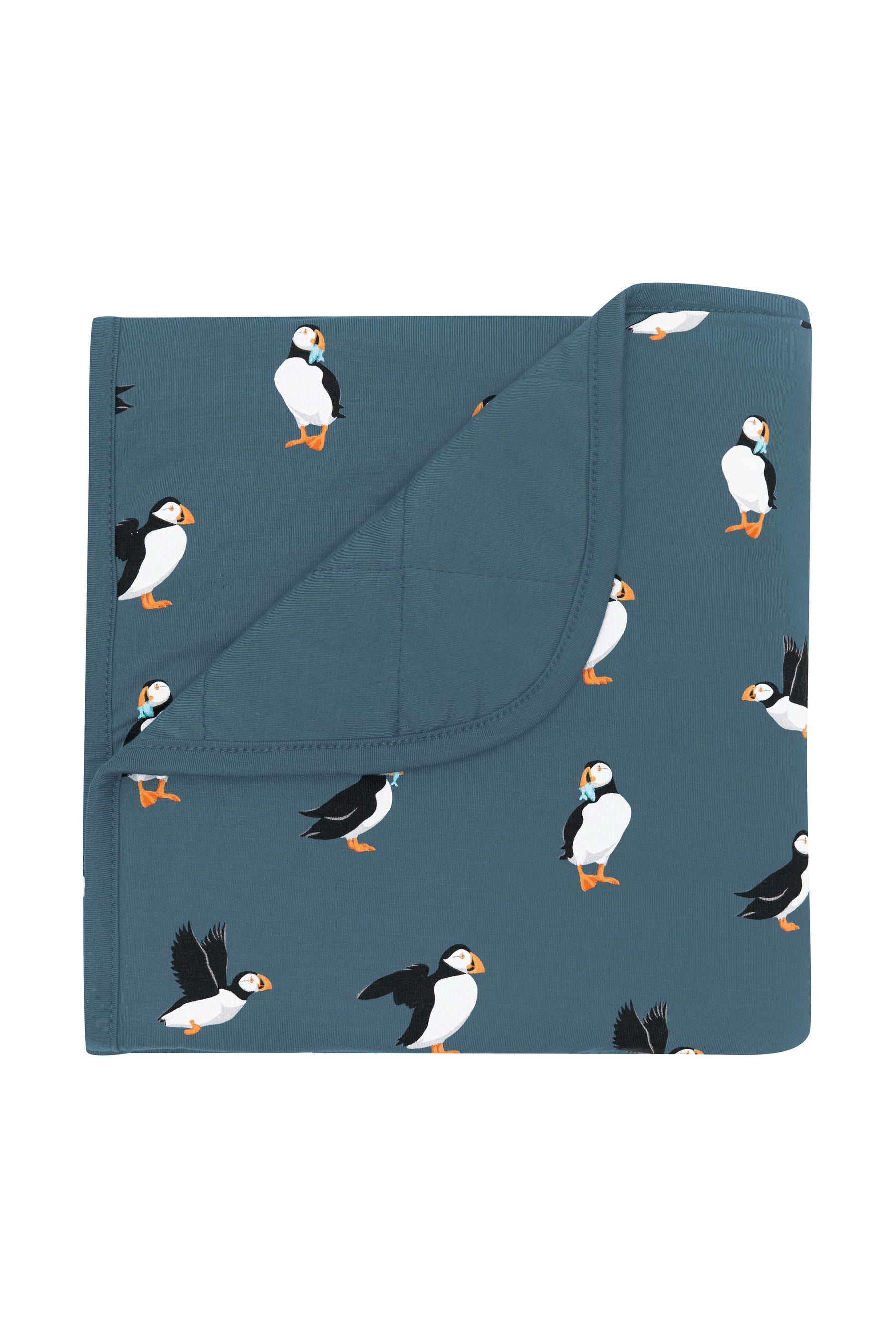 Baby Blanket in Puffin with the corner flipped over showing the Atlantic color backing