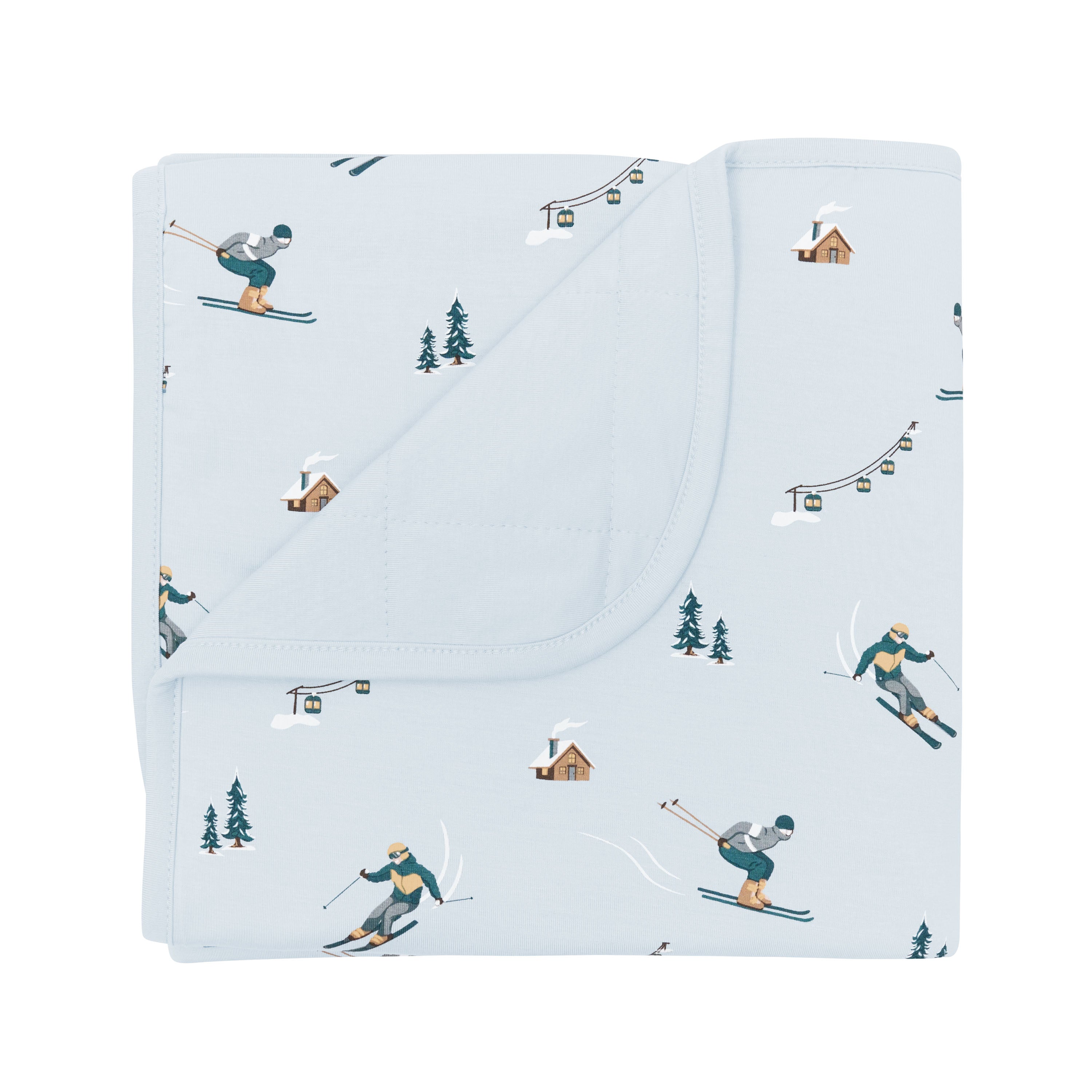 Baby Blanket in Ski with the corner flipped down showing the light blue backing resting on a white surface