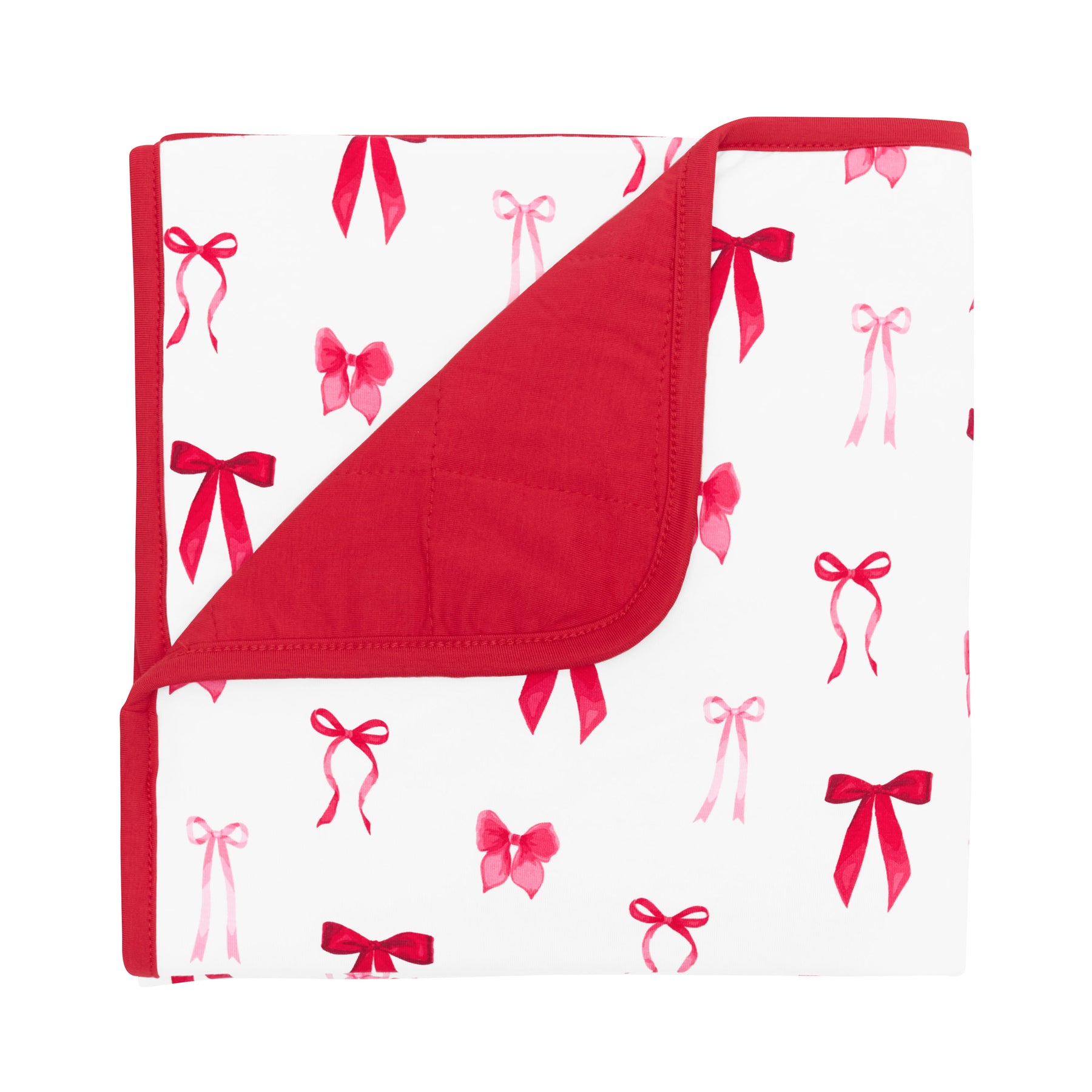 Baby Blanket in Small Love Bow 1.0 with the corner flipped down showing the red backing