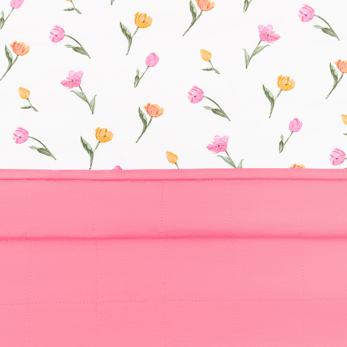 Close up of the quilted pink backing with the smooth top layer on the Baby Blanket in Tulip