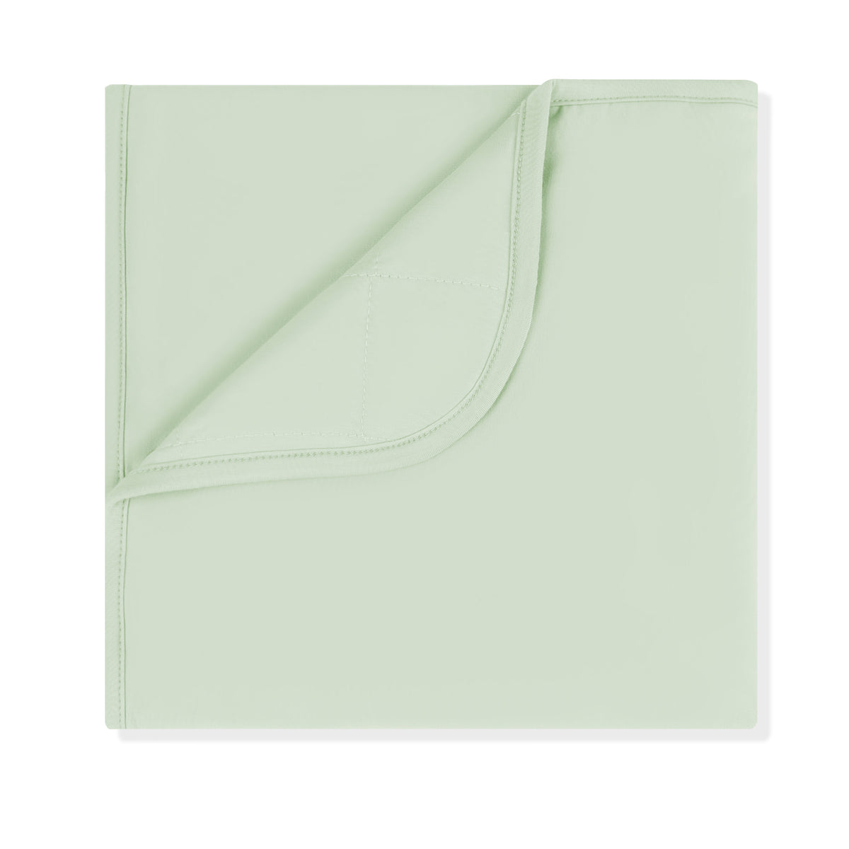 Baby Blanket in Basil 1.0 with the corner folded down showing the quilted backing