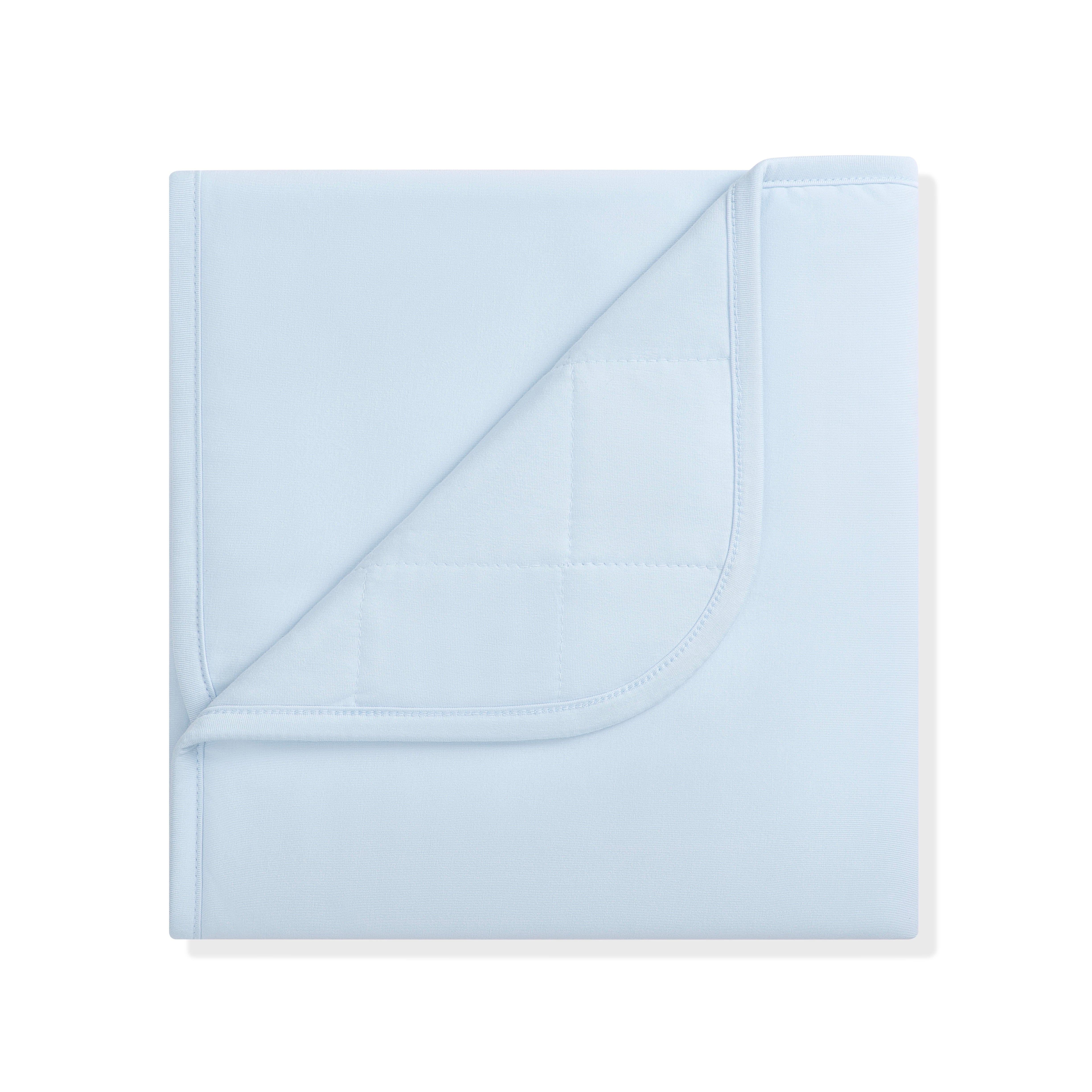 Baby Blanket in Breeze 1.0 with the corner flipped down showing the quilted backing