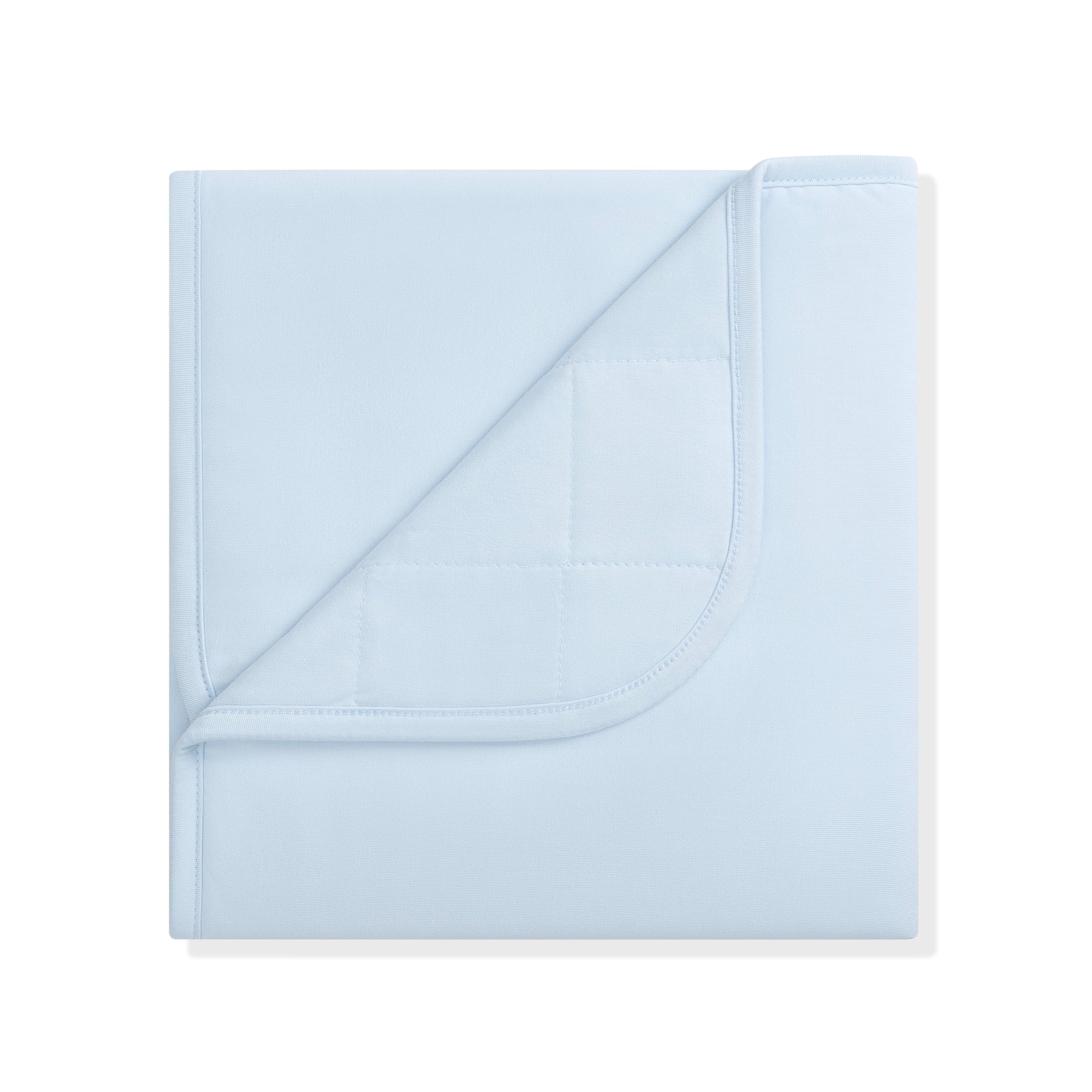 Baby Blanket in Breeze 1.0 with the corner flipped down showing the quilted backing