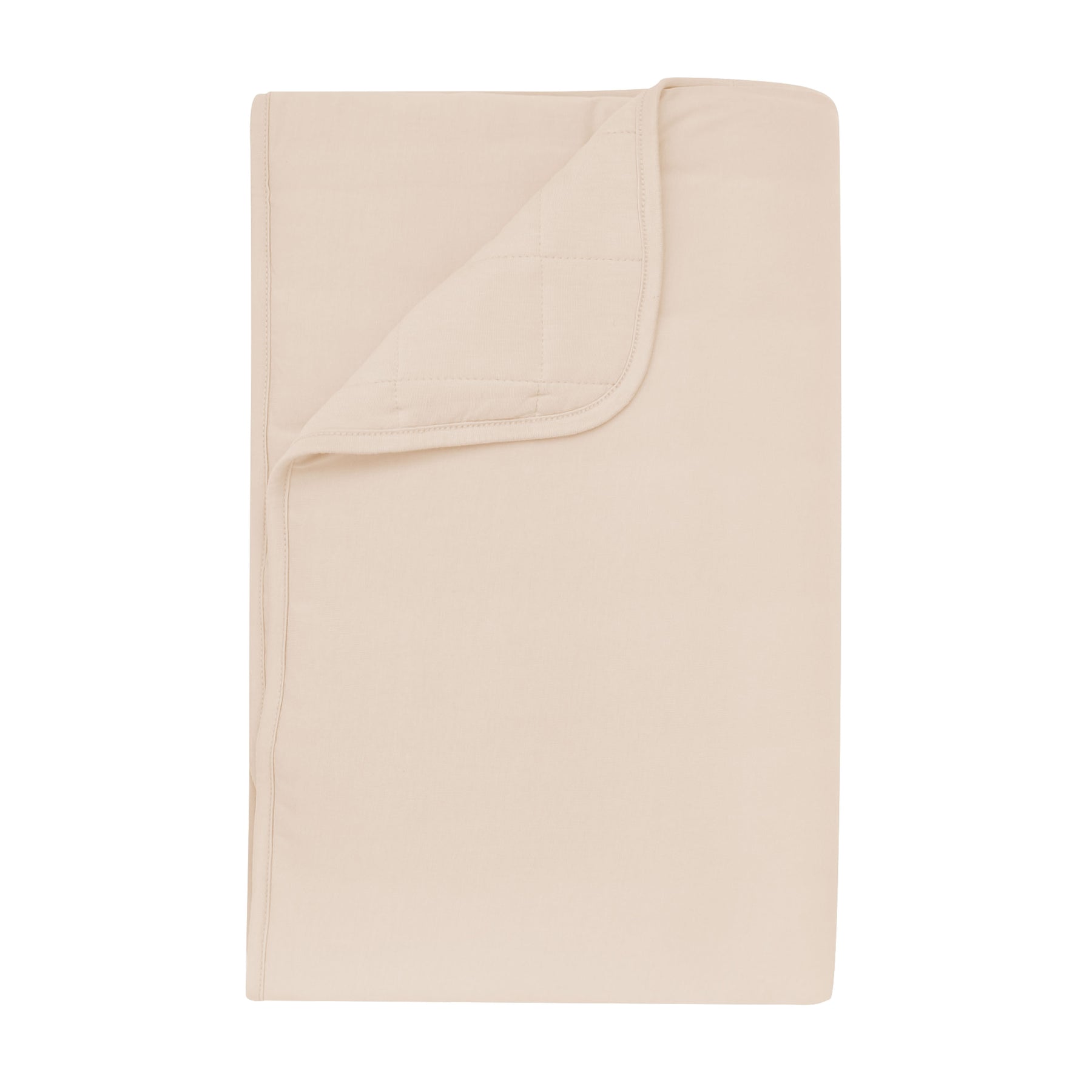 Product photo of the Toddler Blanket in Bisque 2.5 shown with corner flipped down